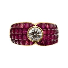 Invisibly Set Ruby Ring with Diamond Center Invisibly Set Ruby Ring with Diamond Center