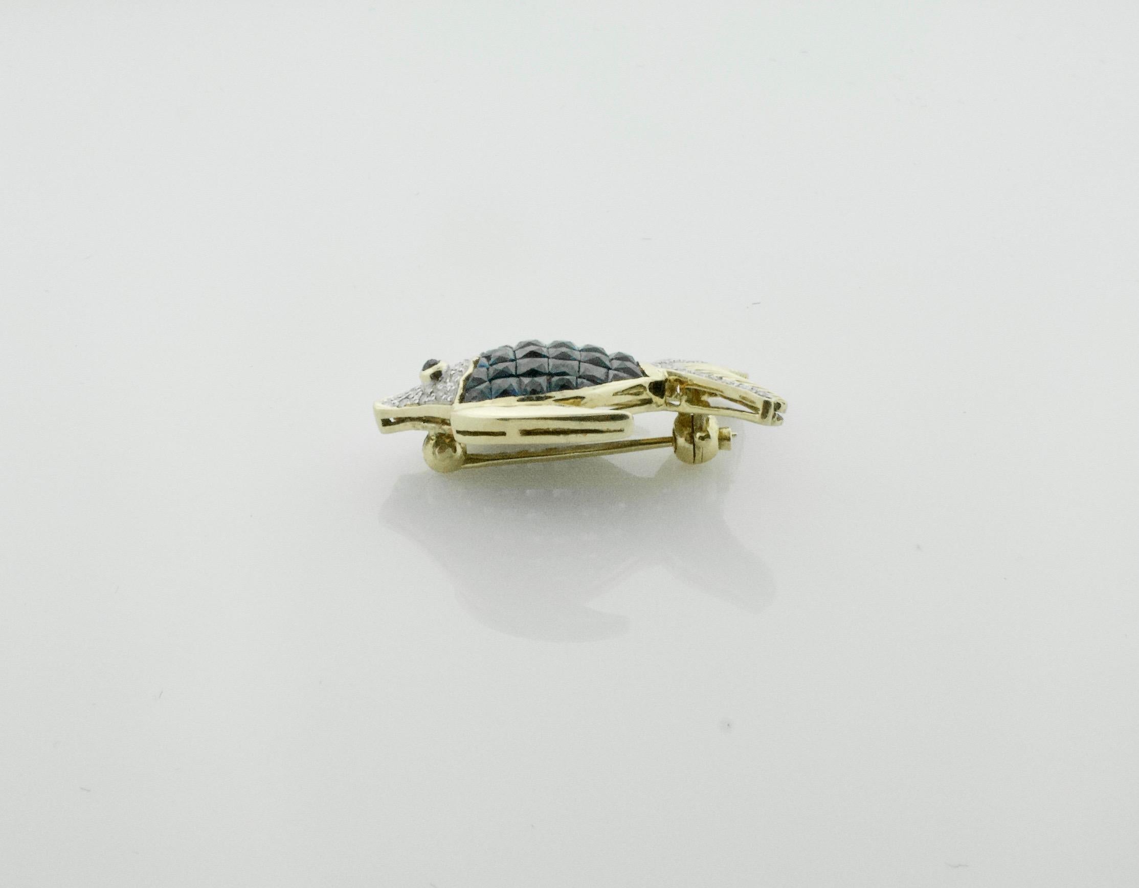 Invisibly Set Sapphire and Diamond Fish Brooch in 18 Karat Yellow Gold For Sale 1