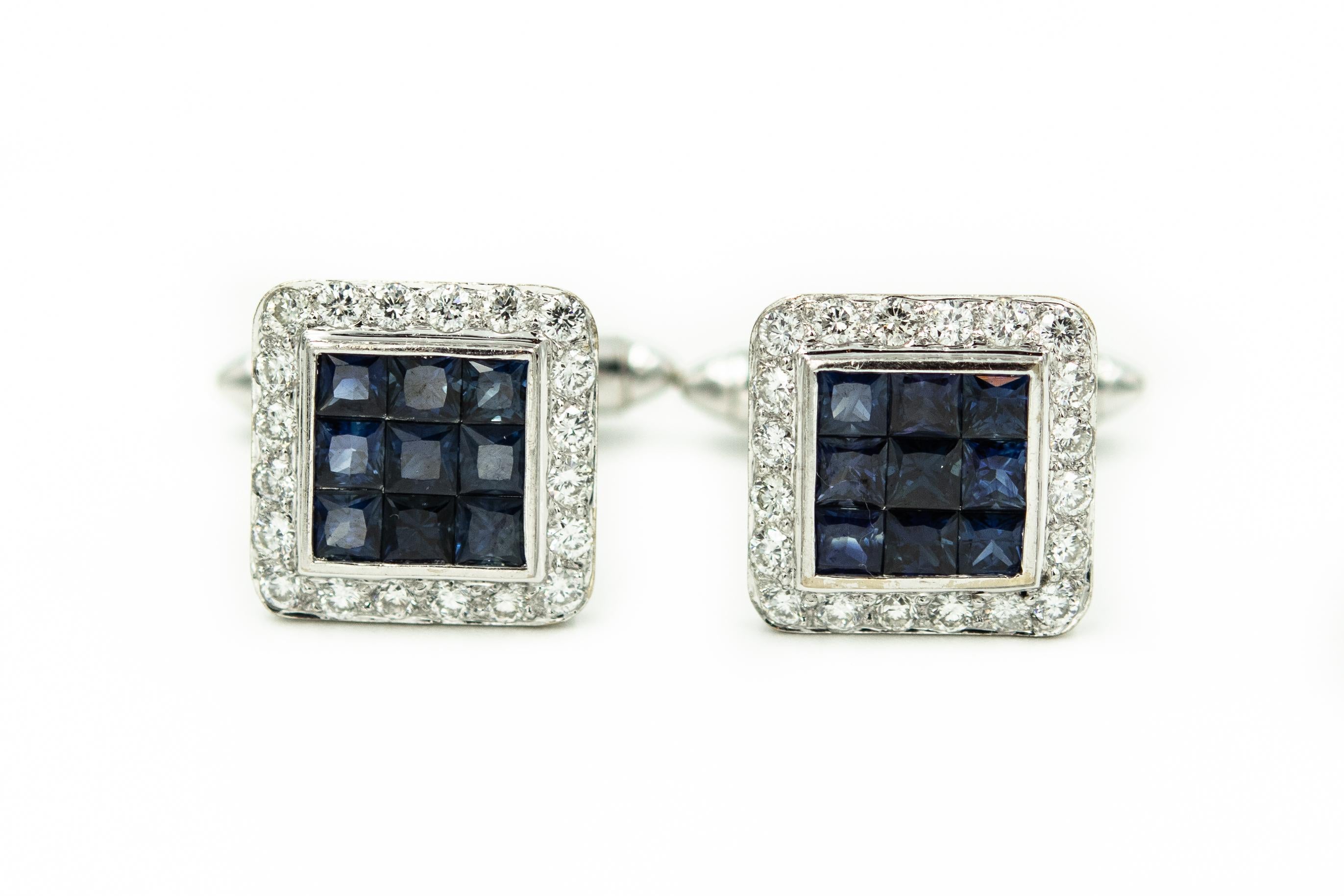 These 18k white gold square cufflinks and tie-tac feature a center section of 9 invisible set princess cut blue sapphires with an outer border of 20 round diamonds in each piece of the set.  The approximate total diamond weight for the set is 2.8
