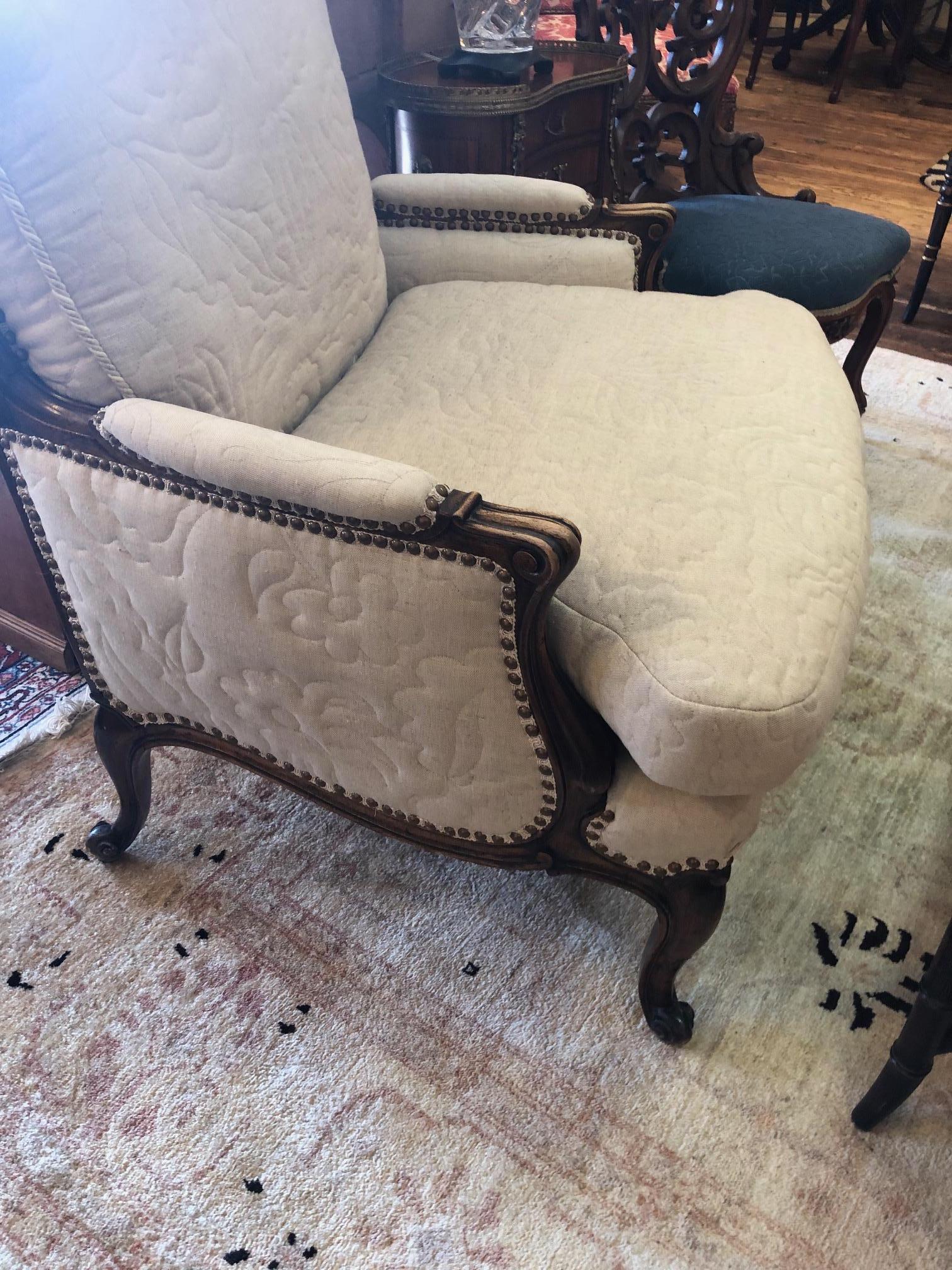 Inviting Carved Walnut Large French Style Club Chair with Quilted Upholstery In Excellent Condition In Hopewell, NJ