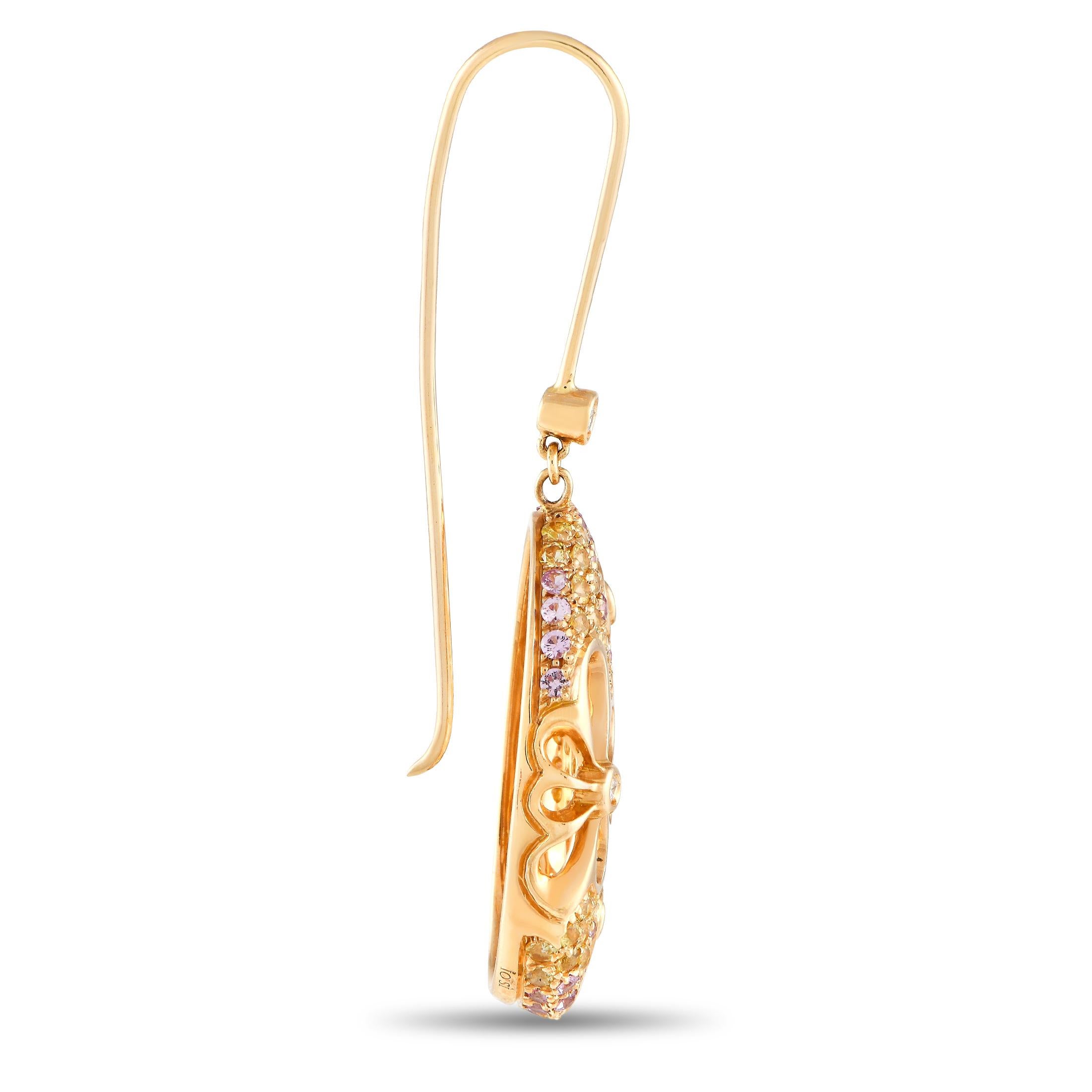 These Io Si earrings have an undeniable charm. Crafted from opulent 18K rose gold, each one measures 2.0” long, 0.75” wide, and includes dynamic cut-out floral motifs. Diamonds with a total weight of 0.19 carats make a statement at the center of the