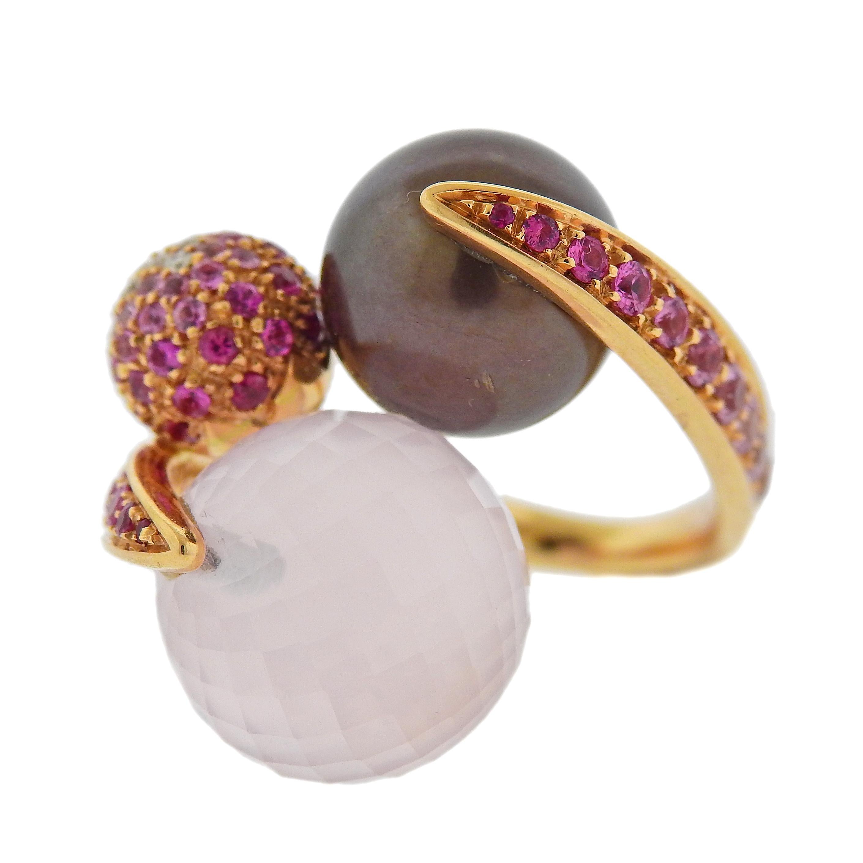 18k gold ring crafted by Io Si. Ring features 2.27ctw in pink sapphires, 0.04ctw in VS G-H diamonds, rose quartz, and pearl. Ring size - 7.5, ring top is 25mm x 26mm, Quartz measures 15.1mm, Pearl is 12.7mm. Total weight 17.8 grams. Marked Io Si,