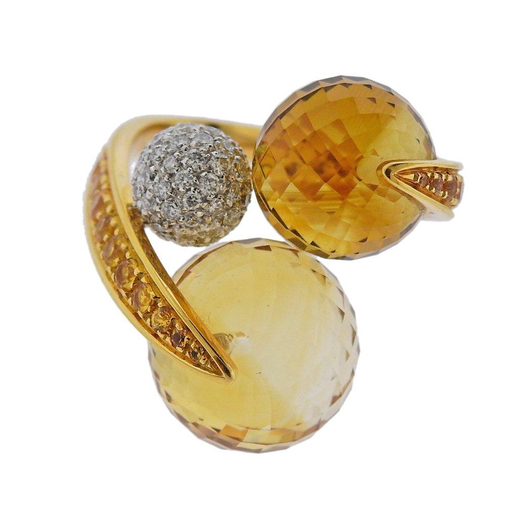 18k yellow gold ring crafted by IO SI. Ring features approximately 1.00ctw of G-H/VS diamonds and yellow sapphires with citrine in sphere shape. Ring size - 8, top of the ring is 27mm. Total weight 16.5 grams. Marked 750, Io Si, 7/50, Italian Mark.

