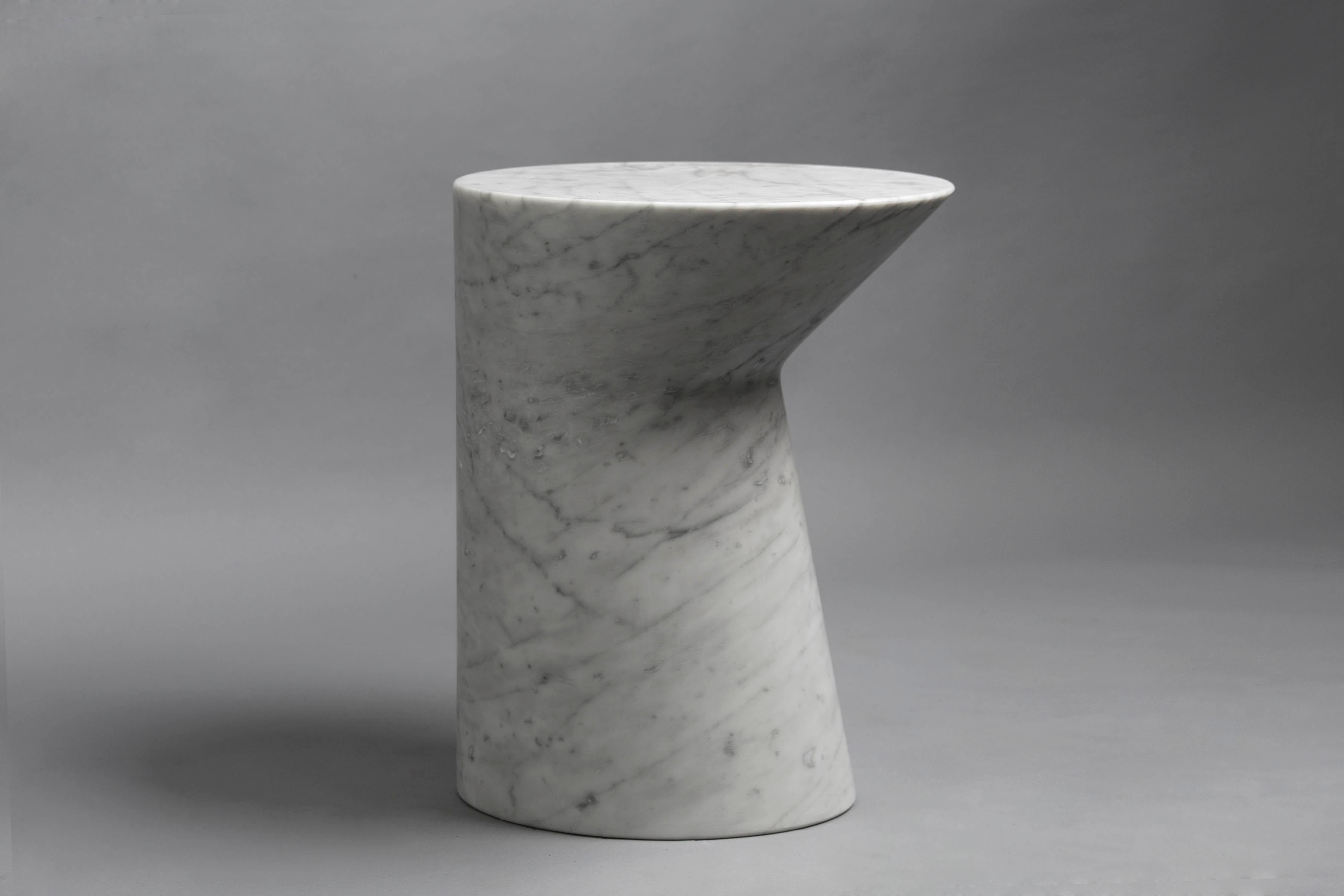 Named after Jupiter’s moon, and much like the moon’s silhouette appearing different each day of the month
Io’s minimal gesture gives the table a new appearance when viewing ti from different angles.
Cut from a single block of Italian Carrara