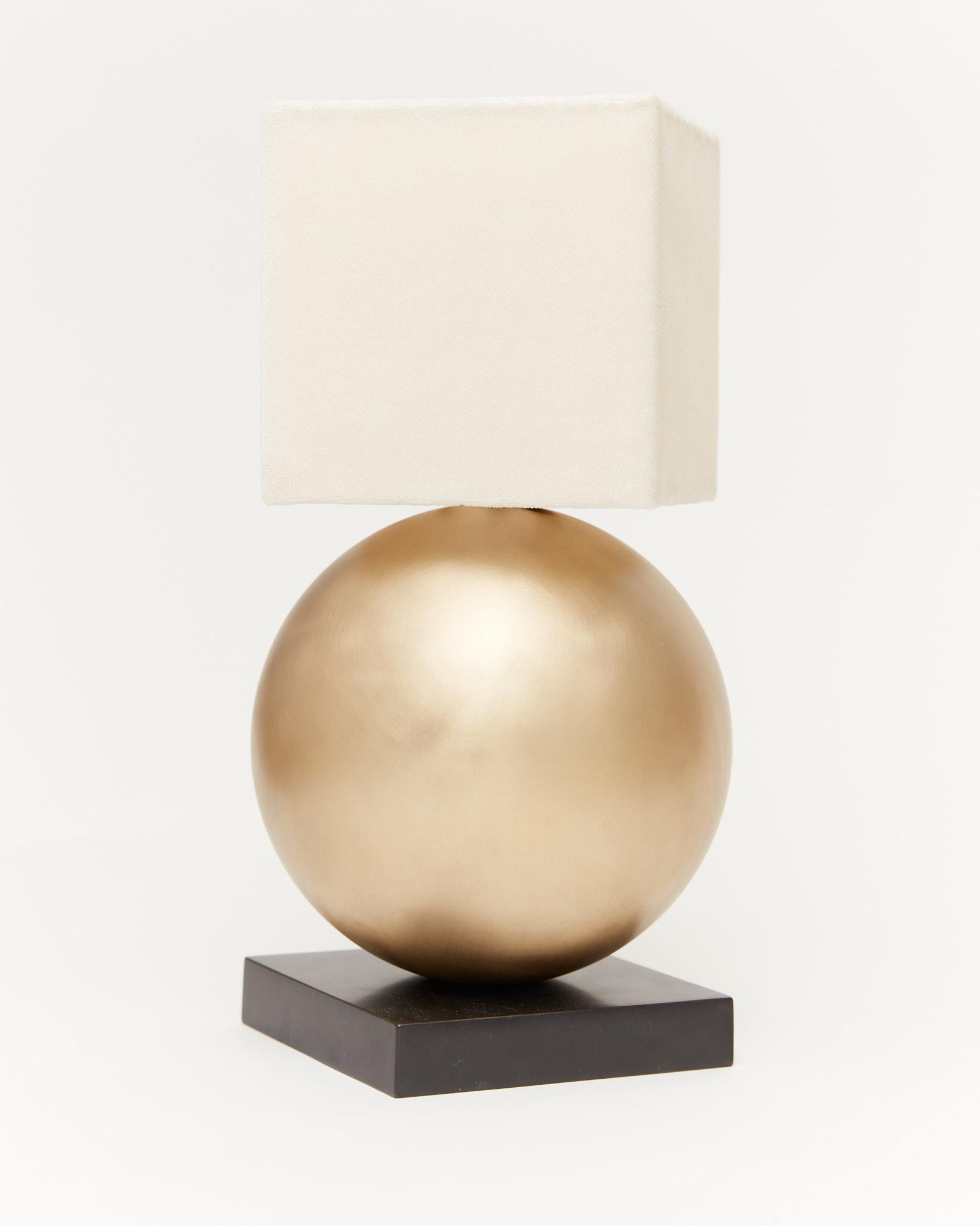 Brushed and blackened brass globe and base with a hand stitched silk velvet shade.

UL listed brass lighting components with in-line switch cord. Wired with Type A plug for North America. Additional wiring options available upon request.

Size