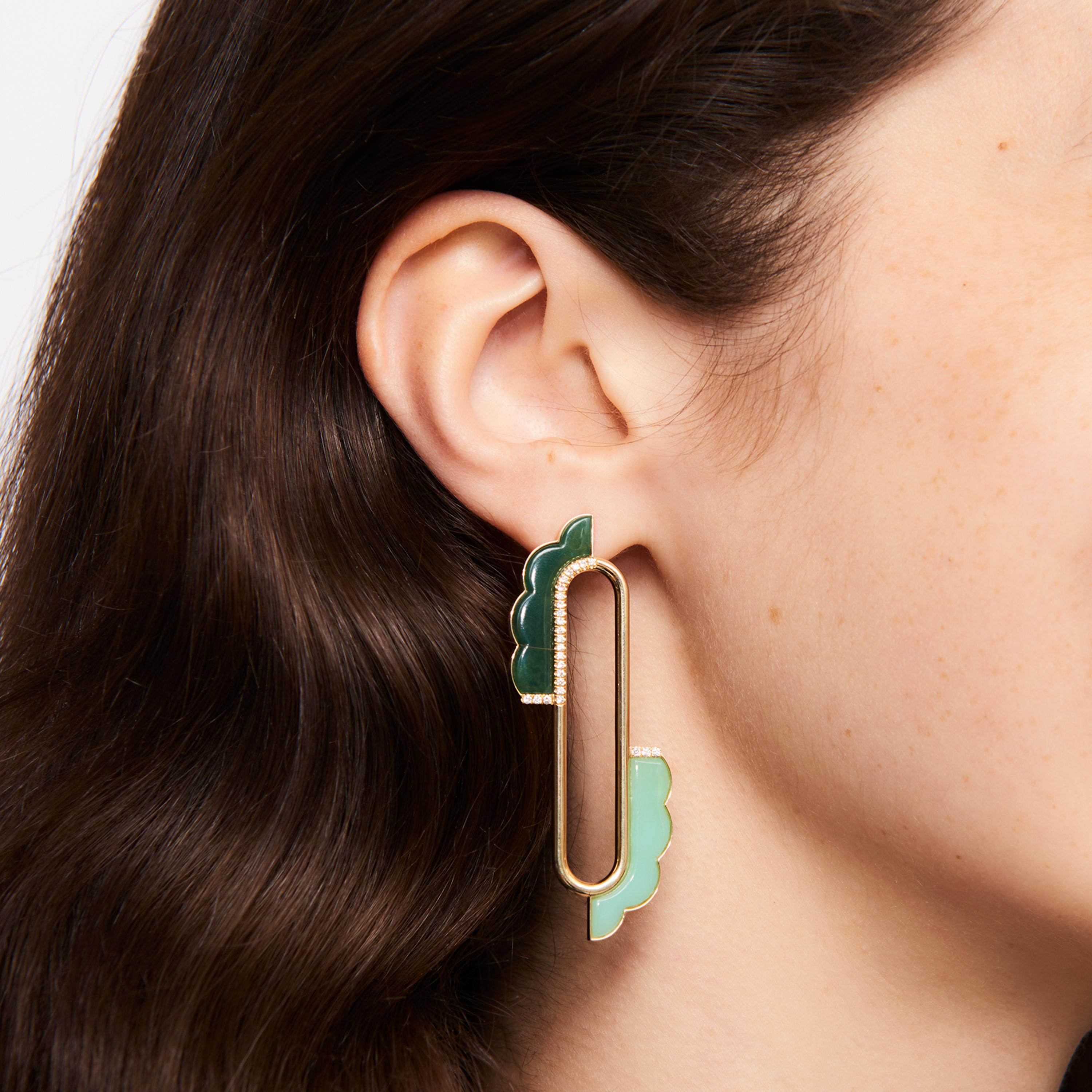 Ioanna Souflia’s Atelier Earrings are crafted from 14 karat yellow gold with sculptural custom cut chromium chalcedony and chrysoprase. She decorates this graphic and voluminous yellow gold silhouette with white brilliant cut diamonds