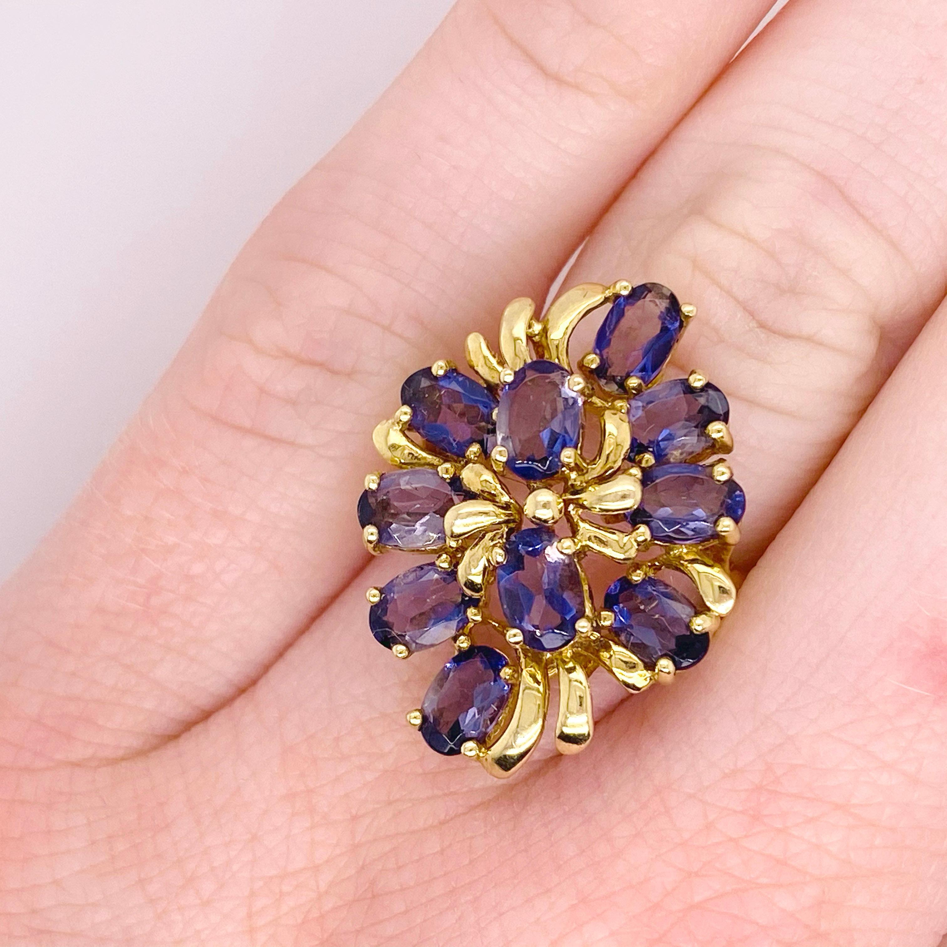 Iolite looks like a light color sapphire and has a nice reflection of color.  This cluster ring is a large statement ring. The ring has 10 perfectly matched iolite gemstones and the design is low on the hand.  The ring has a gorgeous floral style.