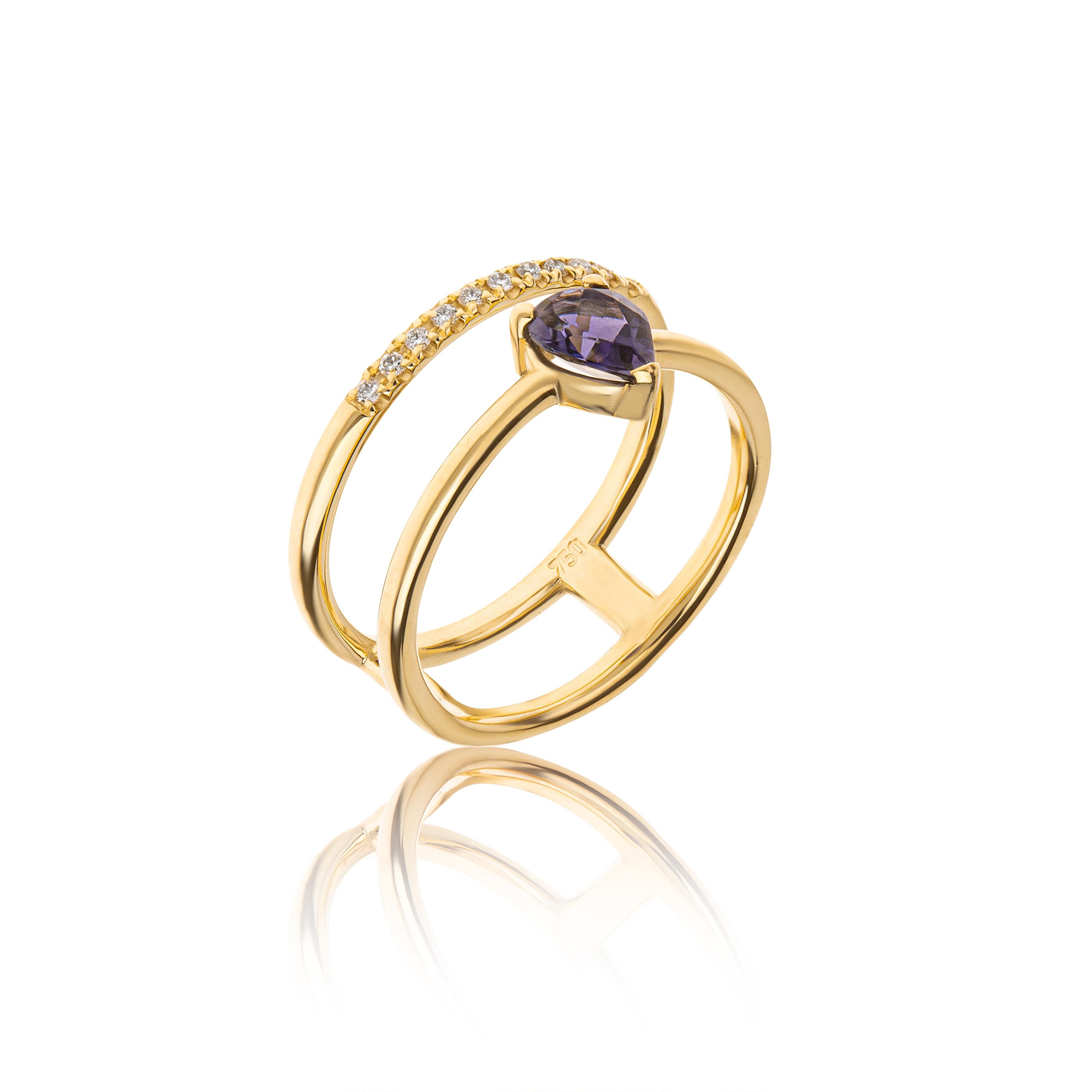 Iolite Pear Cut Double Ring with Diamonds Brilliant Cut in 18Kt Yellow Gold
The ring is hand made in 18Kt yellow gold. The main stone in the center is iolite 0.45ct. pear cut and the second row has diamonds 0.07ct
It is a delicate, modern and