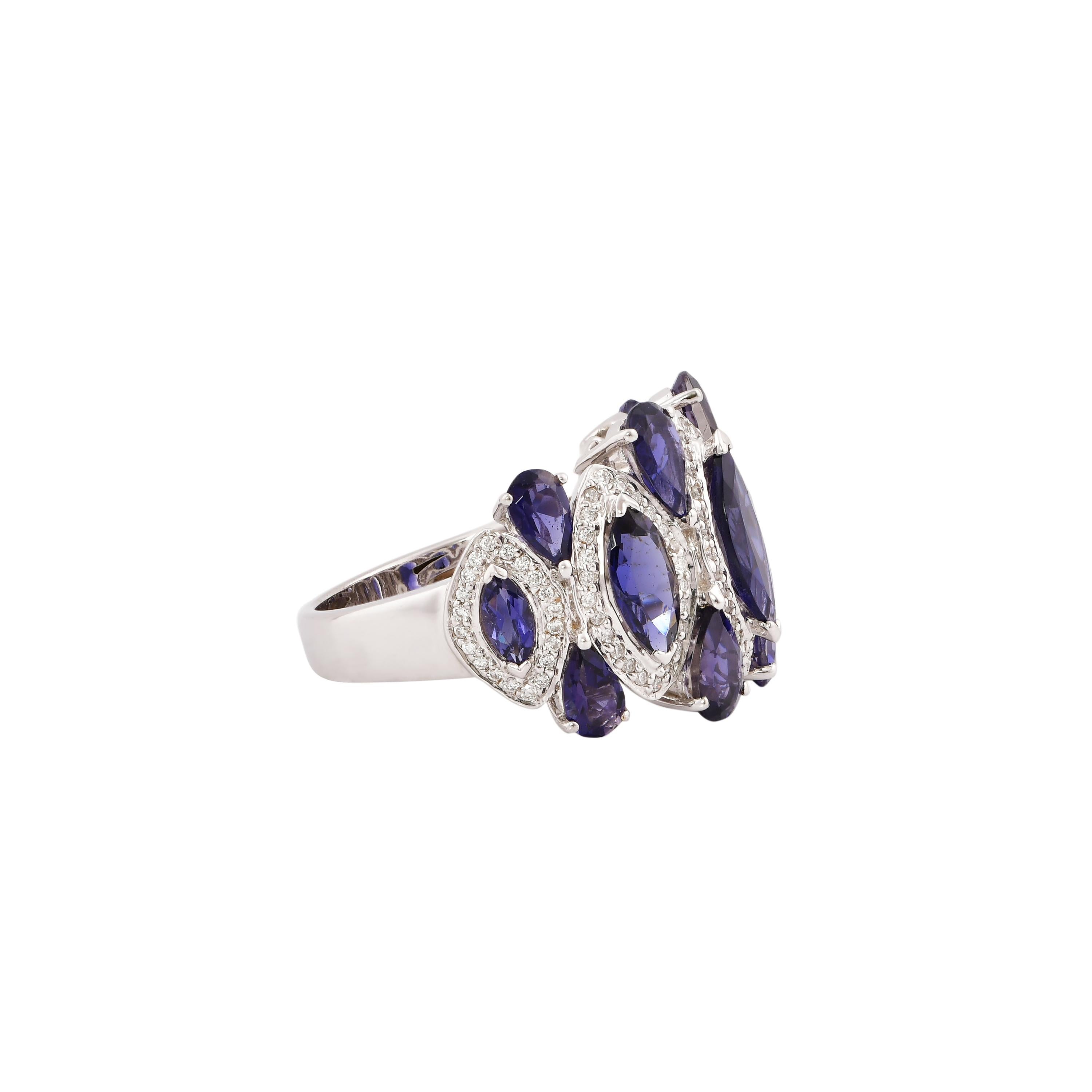 Sunita Nahata presents a collection of fancy cocktail rings with gorgeous gemstones. This ring uniquely pairs pear and marquise shaped iolite accented with diamonds. The banded design makes the a striking yet subtle cocktail ring that will