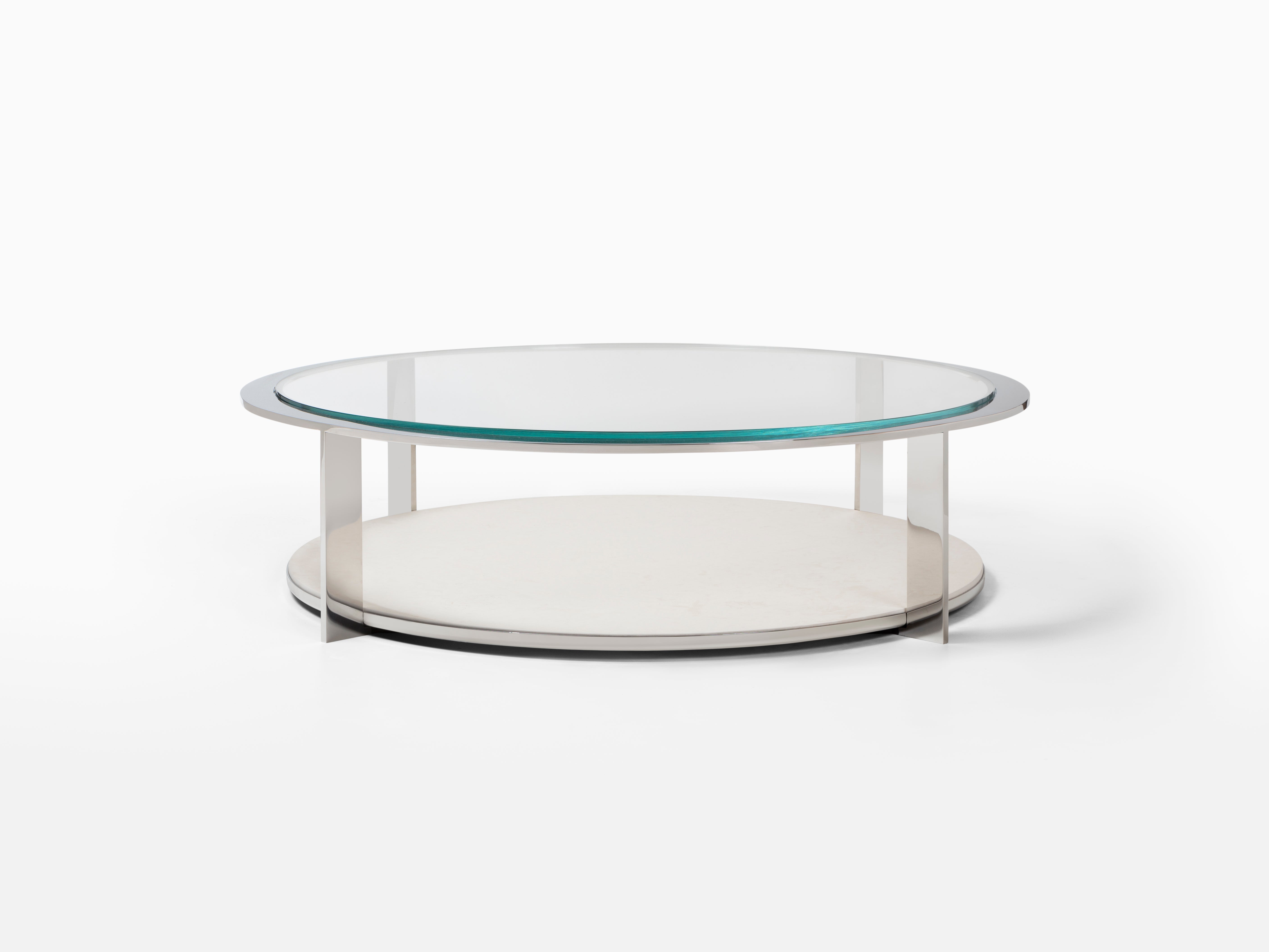 Metal, stone and glass materials are elegantly featured in the Ion Cocktail Table. The round shape and bold materials serve as the perfect focal point to enhance any style of room while providing the perfect display space for your treasured finds.