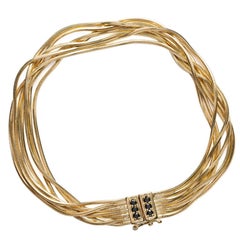 Multi-Strand Bracelet in 18 karat Yellow Gold Black Diamond Paveè IOSSELLIANI