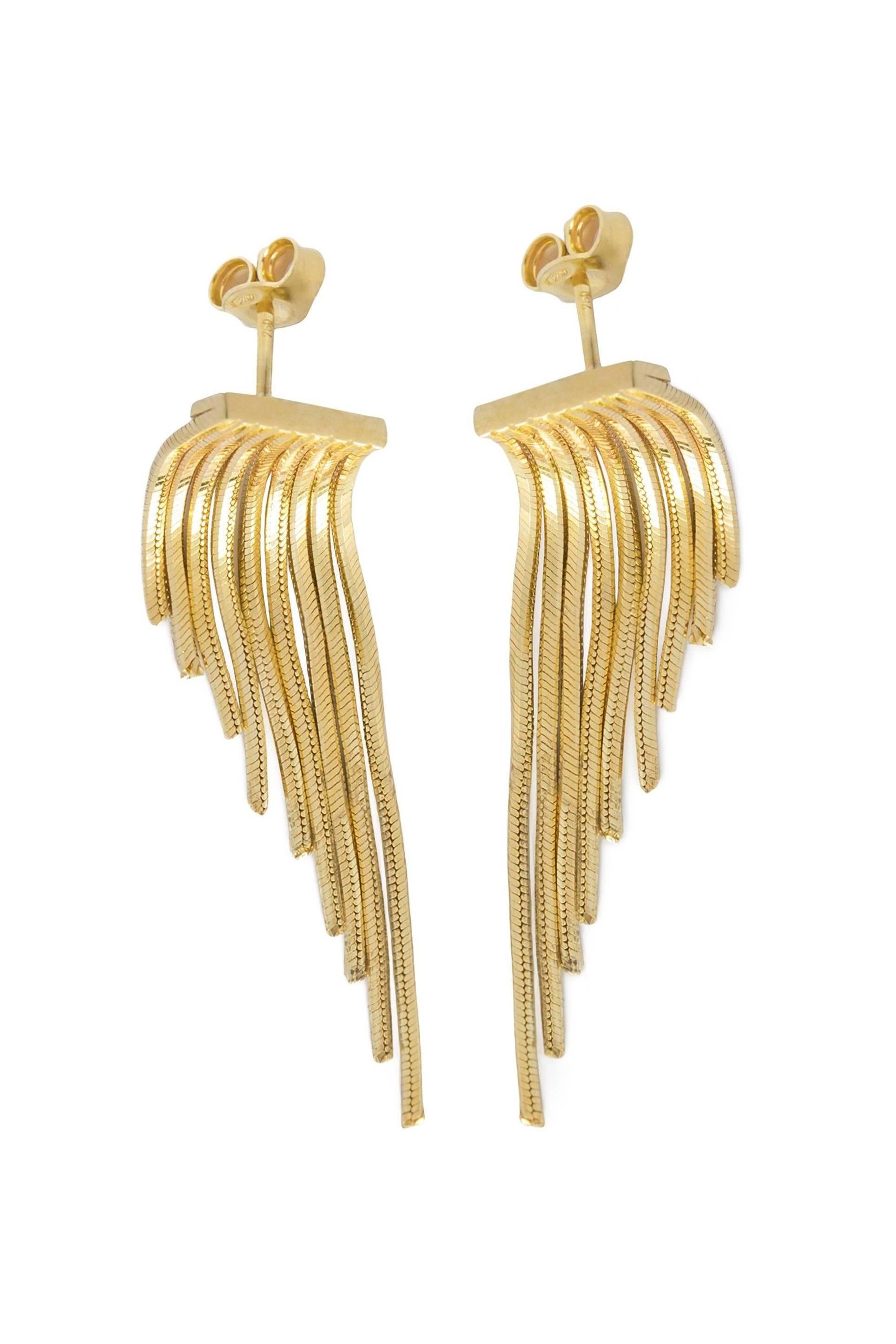 Classic shapes are updated with the inspiration of wings with this pair of earrings from Iosselliani. Specularly designed, the fringed pair is crafted with a cascade of 18 karat gold chains to lend swinging glamour to your daliy wear. Butterfly post