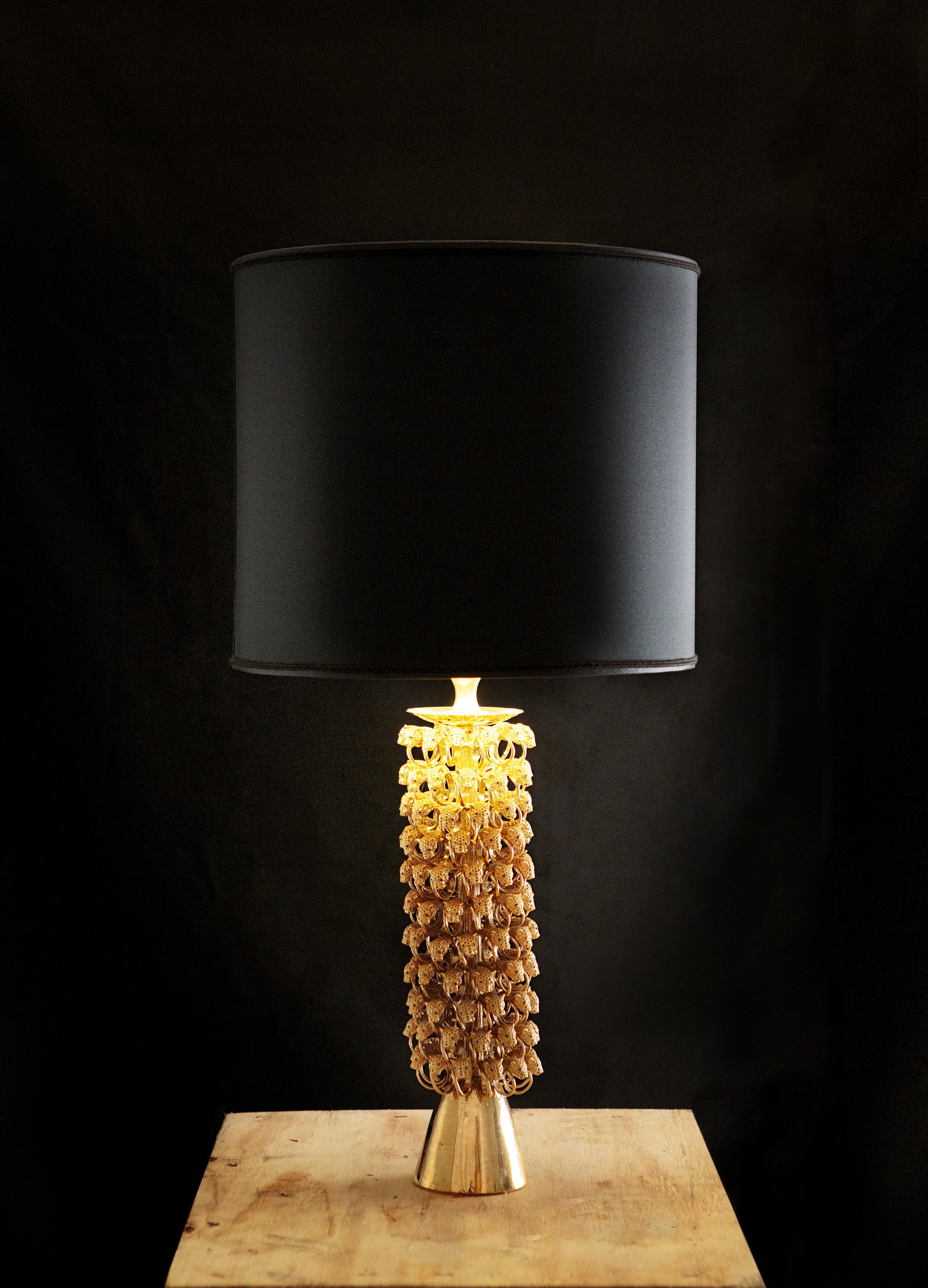 The Circus collection lamp is crafted with over one hundred panthers' heads, ones of the most distinctive Iosselliani’s iconographies to constitute the decorative pattern which wraps the whole body of the piece at 360° as an enchanting and