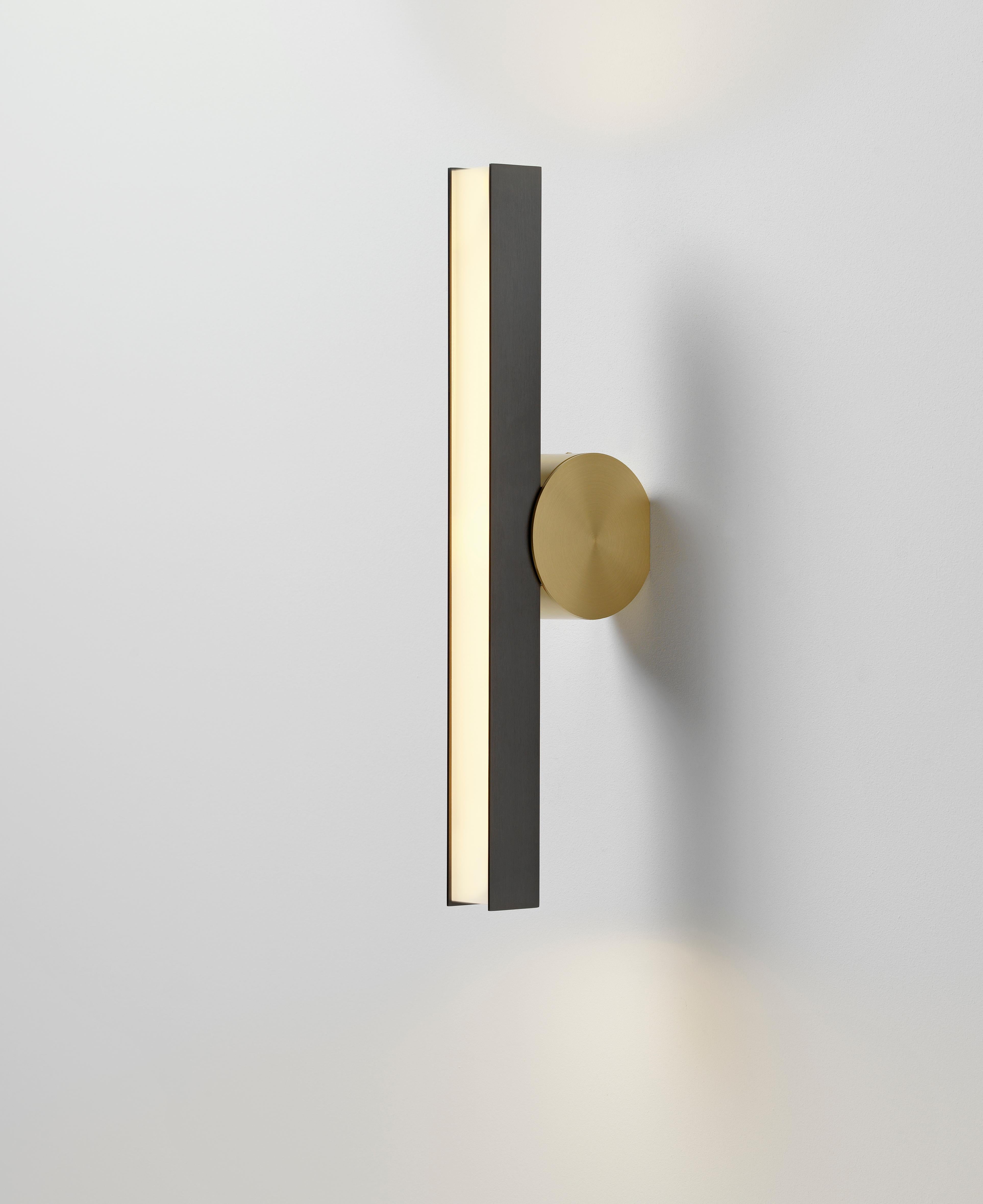IP Calee V2 satin graphite and brass wall light by POOL
Dimensions: D13 x W4.4 X H45 cm
Materials: Solid brass, Satin Graphite, Satin Brass
Others finishes and dimensions available.

All our lamps can be wired according to each country. If sold
