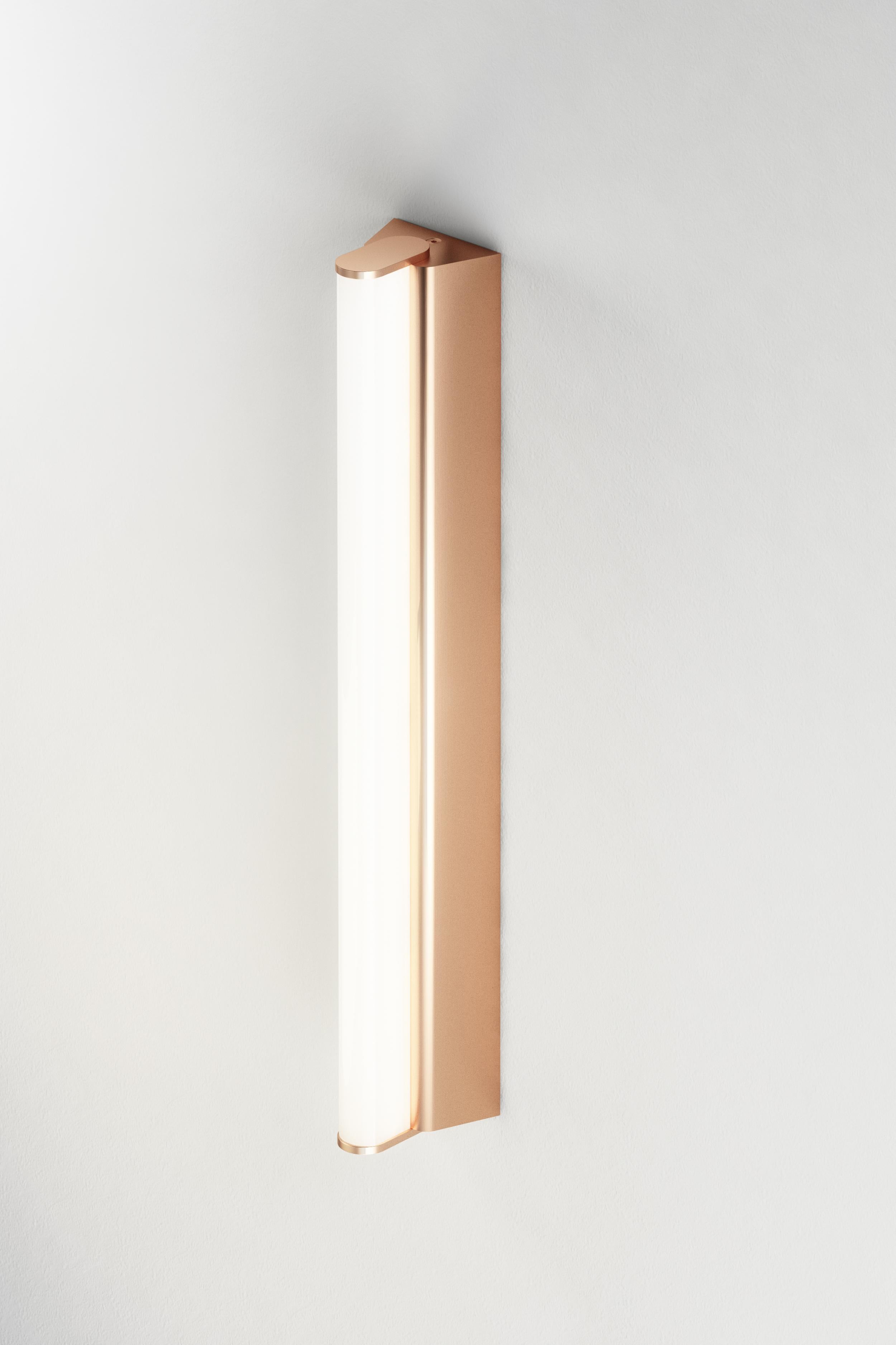IP metrop 325 satin copper wall light by Emilie Cathelineau
Dimensions: D32.5 x W5 x H4.5 cm
Materials: solid brass, satin copper, LED, polycarbonate.
Others finishes and dimensions are available.

All our lamps can be wired according to each