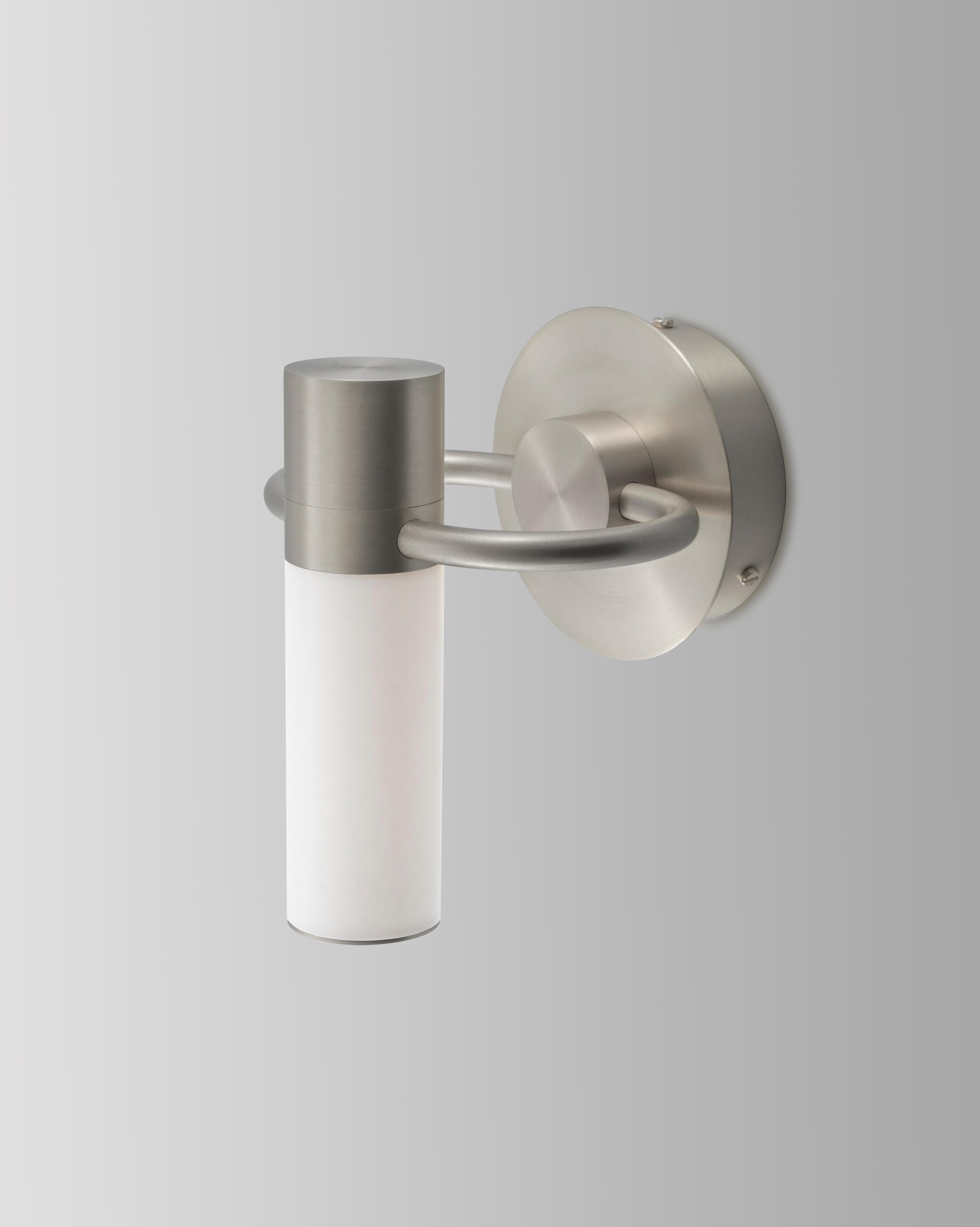 IP storm satin nickel wall light by Emilie Cathelineau
Dimensions: D15.5 x W15.5 X H19 cm
Materials: Solid brass, Satin nickel, White Polycarbonate.
Others finishes are available. 

All our lamps can be wired according to each country. If sold