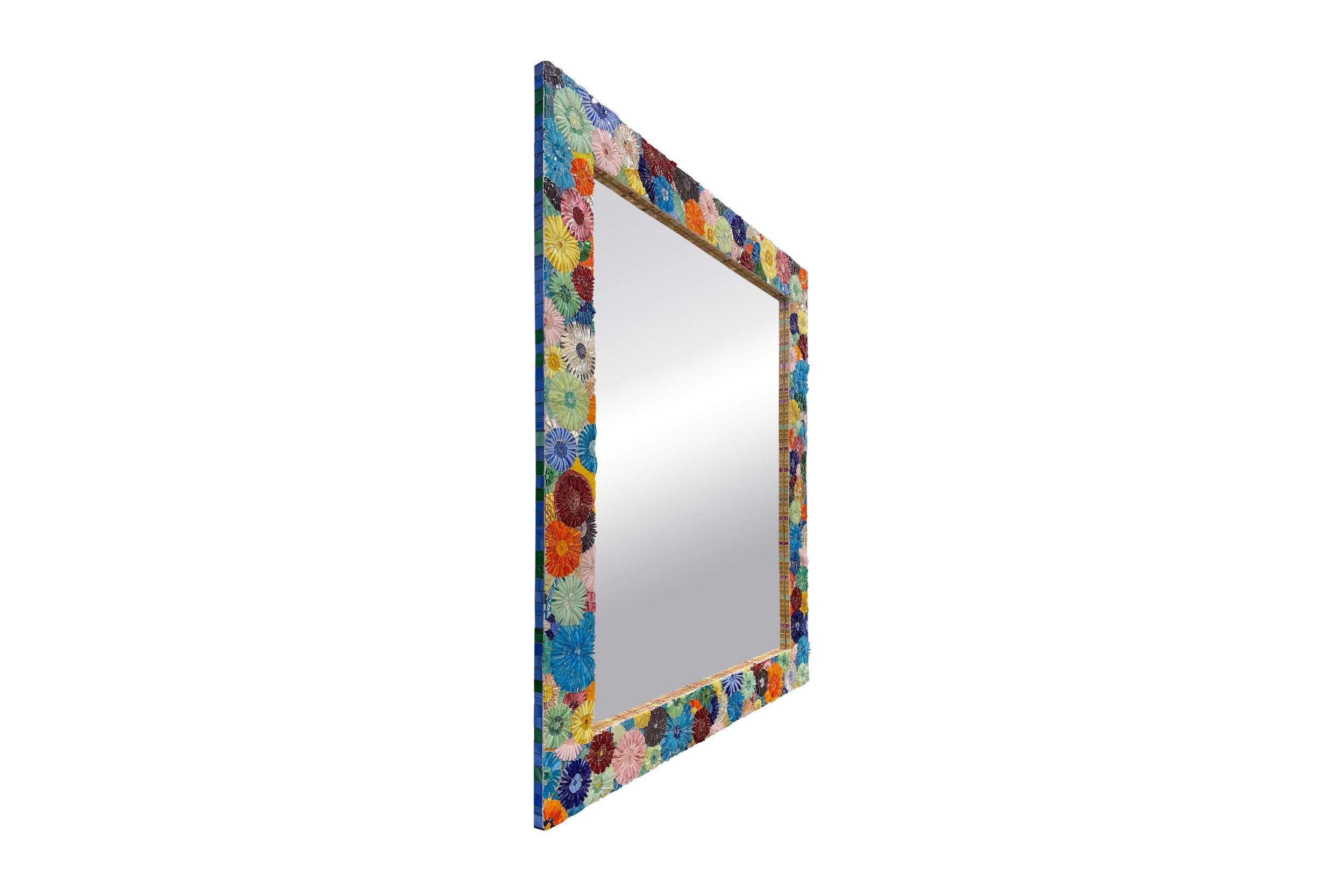 Inspired by the beaches of Brazil, the Ipanema mirror by Ercole Home is a bright, colorful, statement piece in any room. Covered in our one of a kind blossom pattern and a variety of warm saturated glass this mirror brings so much excitement to the