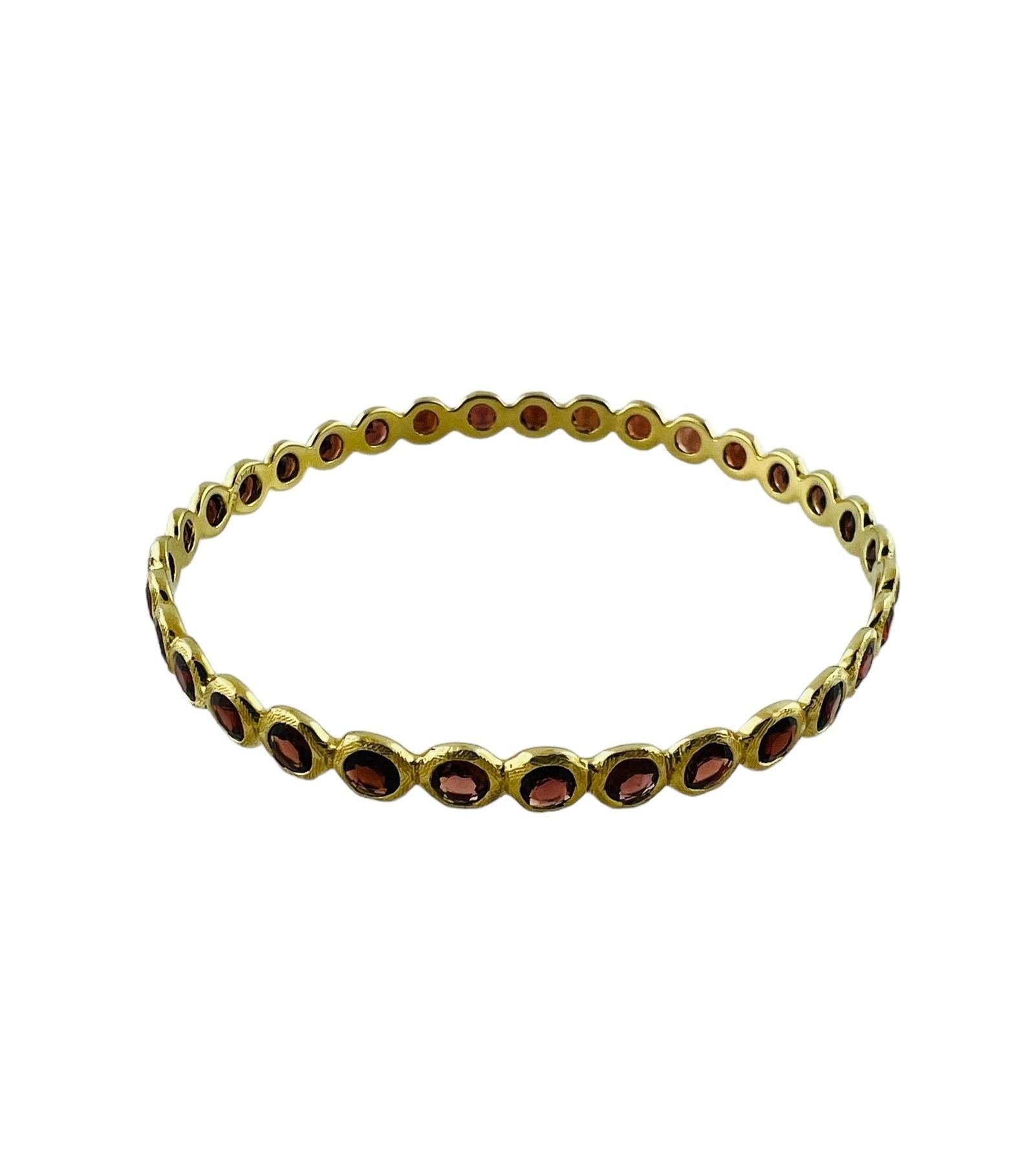 Ippolita 14K Yellow Gold Garnet Bangle Bracelet

This beautiful Ippolita bracelet is bezel set with 33 garnet stones

Hammered finish

Bracelet is approx. 7 3/4