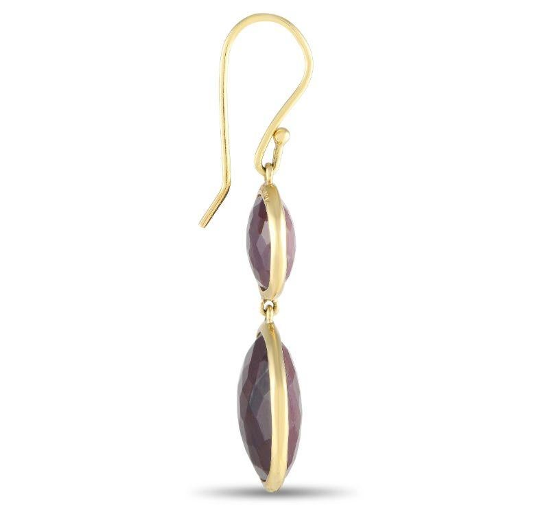 Circular ruby gemstones are beautifully highlighted by a minimalist 14K Yellow Gold setting on these exquisite Ippolita earrings. The perfect combination of stunning and understated, each earring measures 1.65” long and 0.65” wide. 
 
 This jewelry