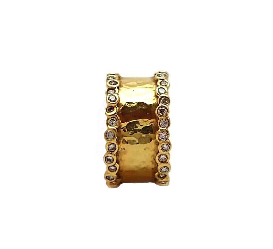 This hammered band of 18k yellow gold and bezel set diamonds is the kind of work-of-art that makes the Greek jeweler Ippolita famous.  Contains almost a carat of round brilliant cut diamonds, G color, VS clarity.
