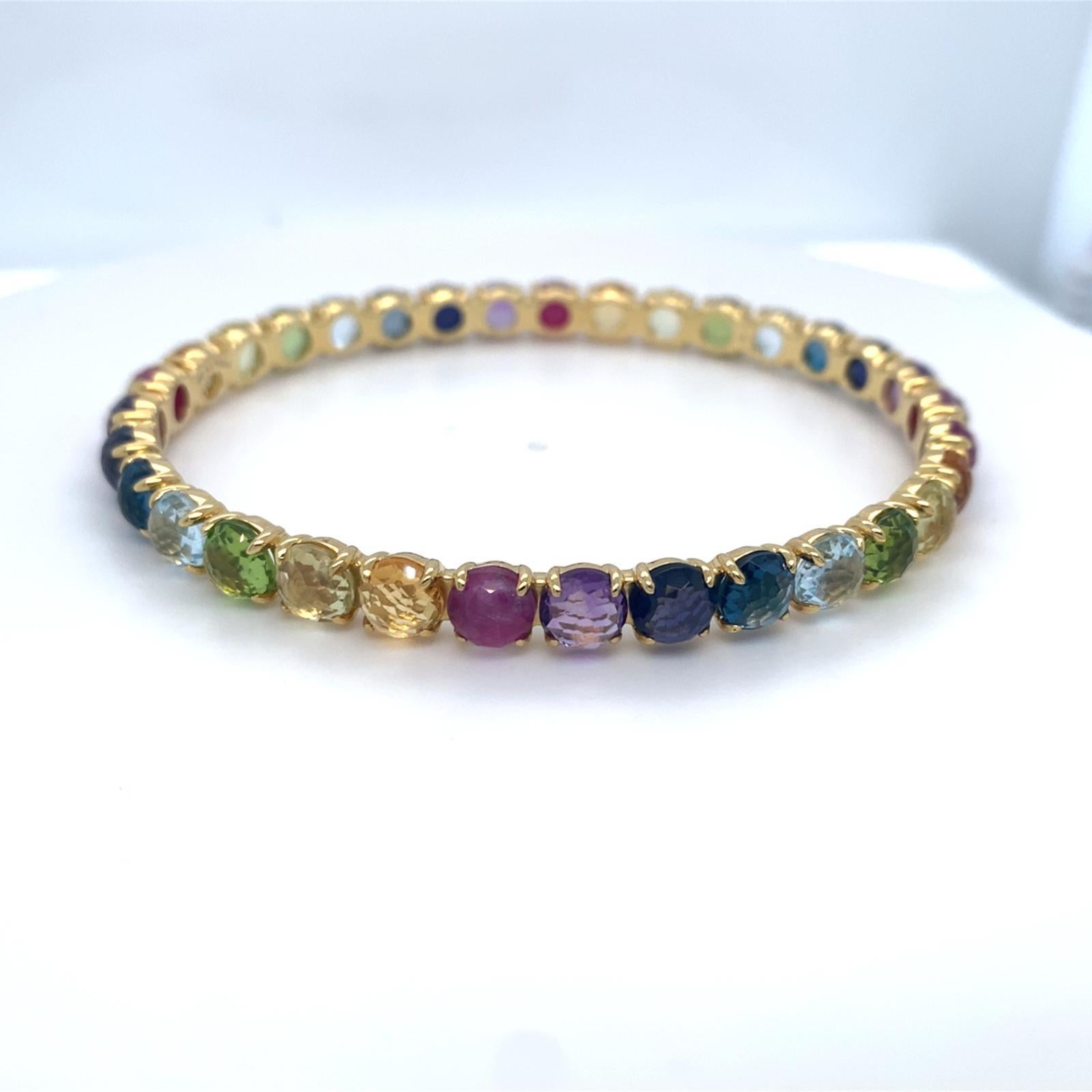 Caractéristiques Pierres précieuses rondes arc-en-ciel montées en or jaune 18 carats
Marque : Ippolita
Poids approx. : 22,5 grammes
Diamètre : 2.5 pouces
Taille unique, non réglable.
État général : Très bon. Les signes d'utilisation ou d'usure sont