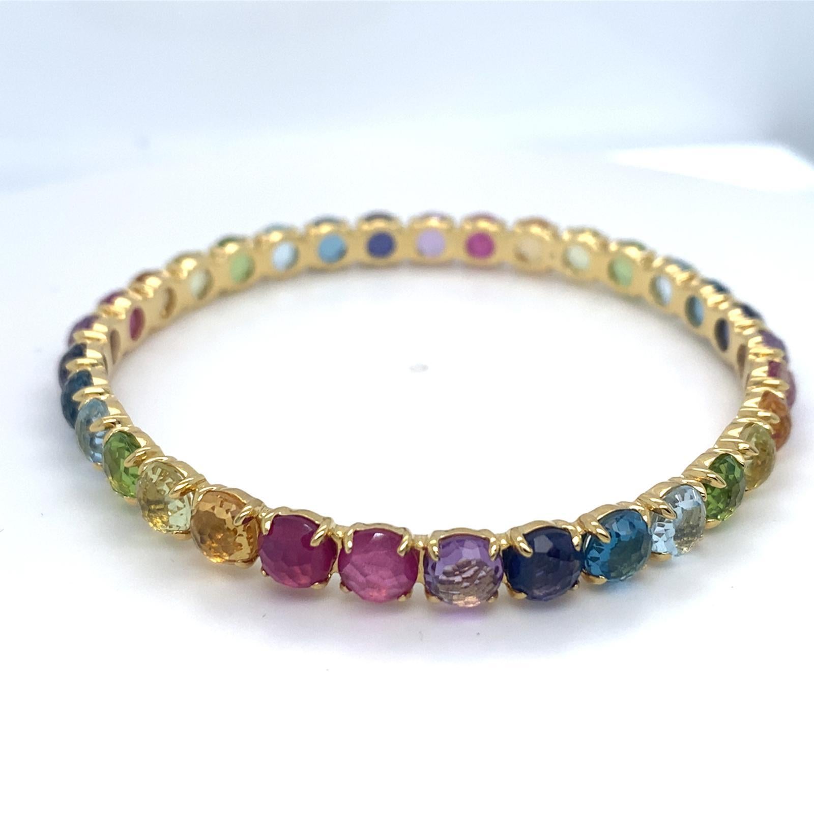 Pierres précieuses arc-en-ciel montées en or jaune 18 carats
Marque : Ippolita
Poids brut : 22,5 grammes
Diamètre : 2.5 pouces
Taille unique, non réglable.
NOTE : Le bracelet est légèrement déformé. Voir les photos pour plus de détails.

Référence