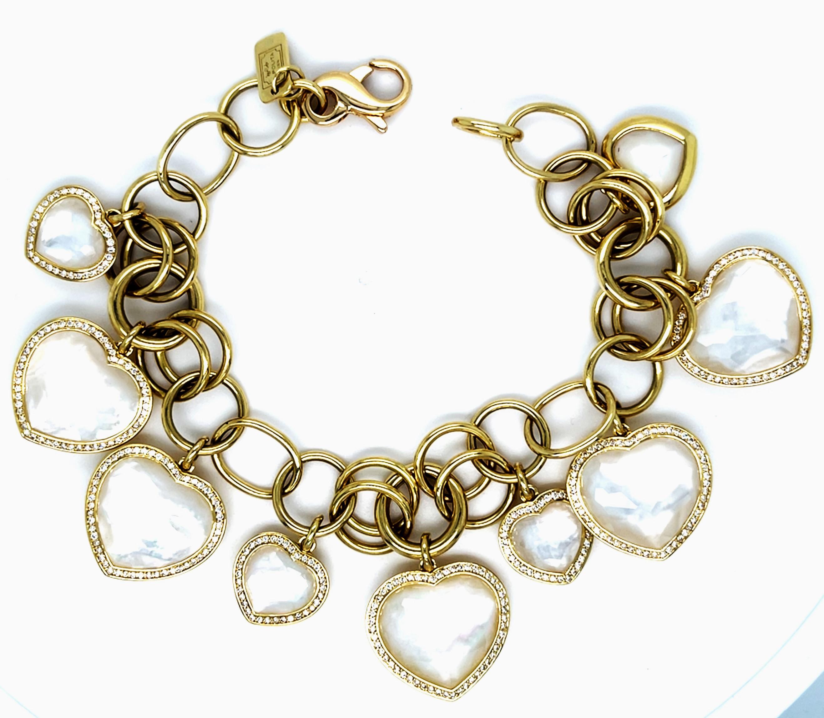 Gorgeous Charm Bracelet by Ippolita
Features 9 Faceted Quartz/Mother-of-Pearl Stones in Heart Bezel Settings
Accent Diamonds on Each Bezel
Total Length of Bracelet = 7.5
