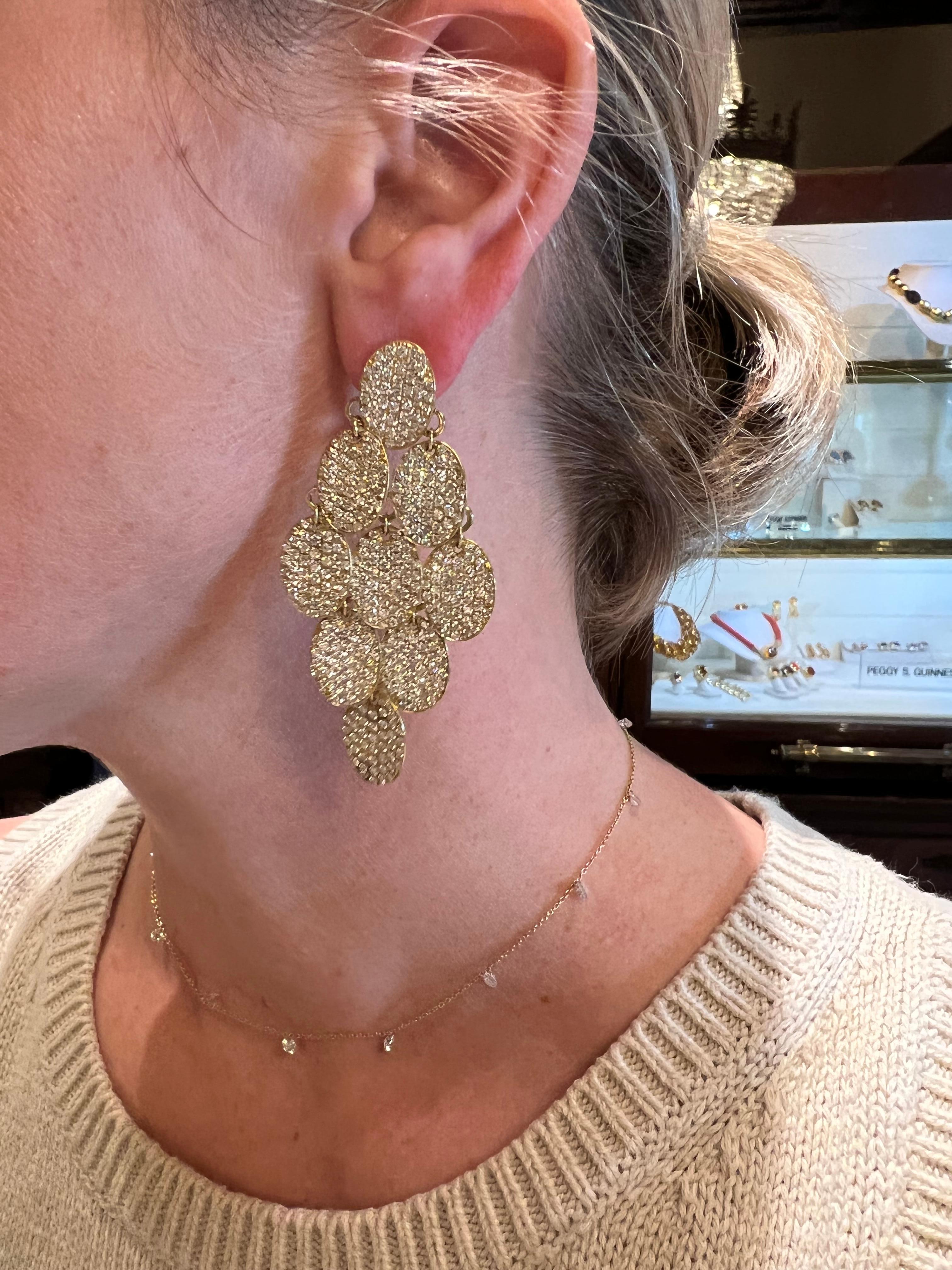 Estate Ippolita 'Cascade' long chandelier drop earrings, each featuring nine pavé diamond-set oval-shaped discs in 18k yellow gold. 846 diamonds weighing ~9.75 total carats, Omega clip backs with posts. Signed 