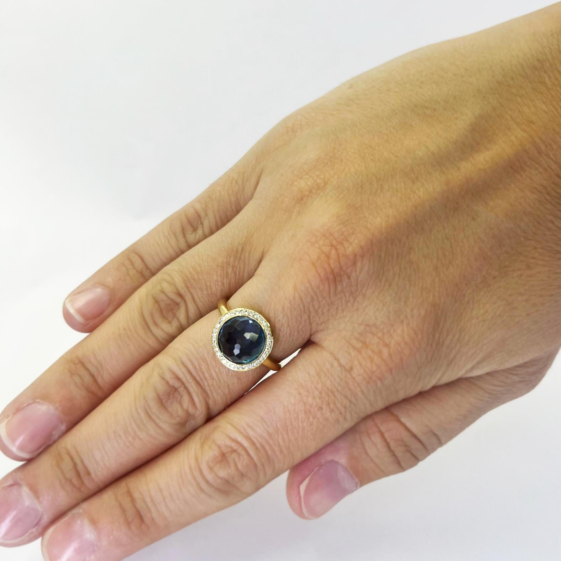 Ippolita Lollipop ring featuring a bezel set round blue topaz surrounded by 0.18 carat total weight round diamonds. Finger size 7. Includes One Sizing Service Upon Request, Prior to Shipping. Finished weight is 5.1 grams. $1,695 MSRP.