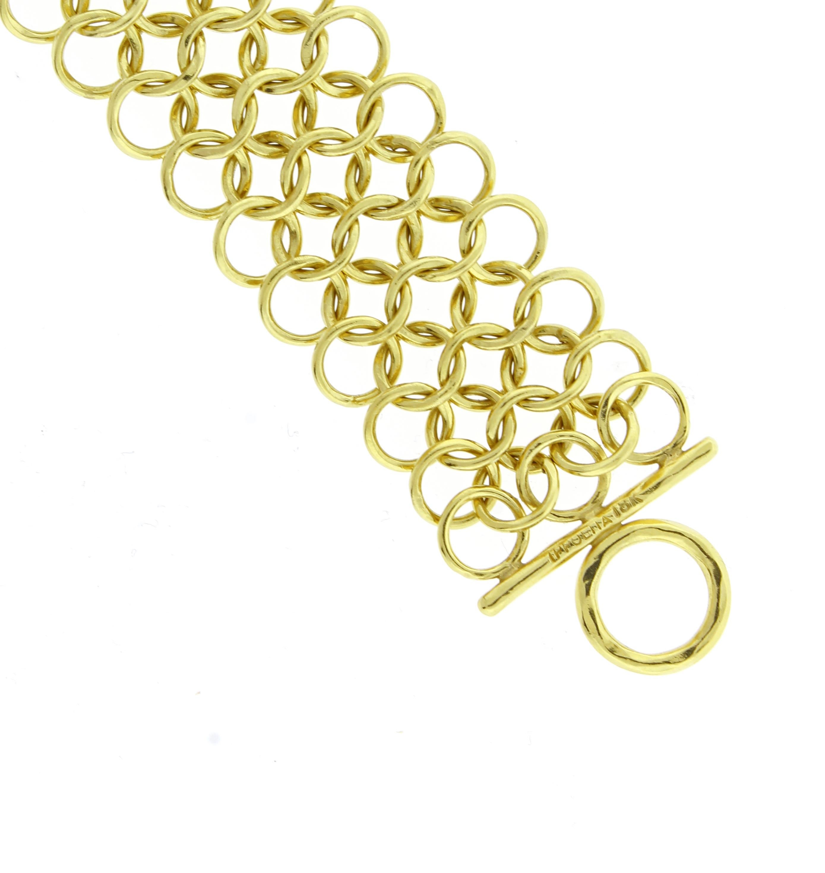 From Ippolita thier  triple  interlocking circle link bracelet
♦ Designer:  Ippolita 
♦ Metal: 18 karat
♦ 7 ¼ inchs long  7/8 inch wide
♦ 37.2 grams
♦ Circa 2010
♦ Packaging: Pampillonia presentation box 
♦ Condition: Excellent , pre-owned
♦ Price: