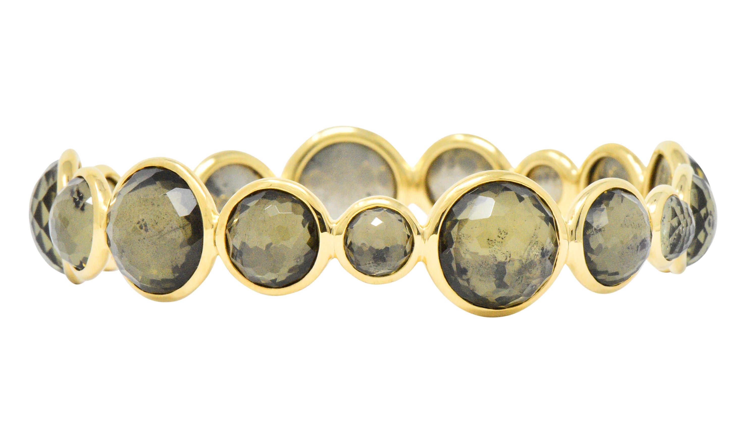  Bangle style bracelet set all the way around with round checkerboard citrine of various sizes, measuring approximately 7.0 to 13.0 mm

The citrine are bezel set and backed with pyrite

From the Lollipop collection 

Singed Ippolita for Ippolita