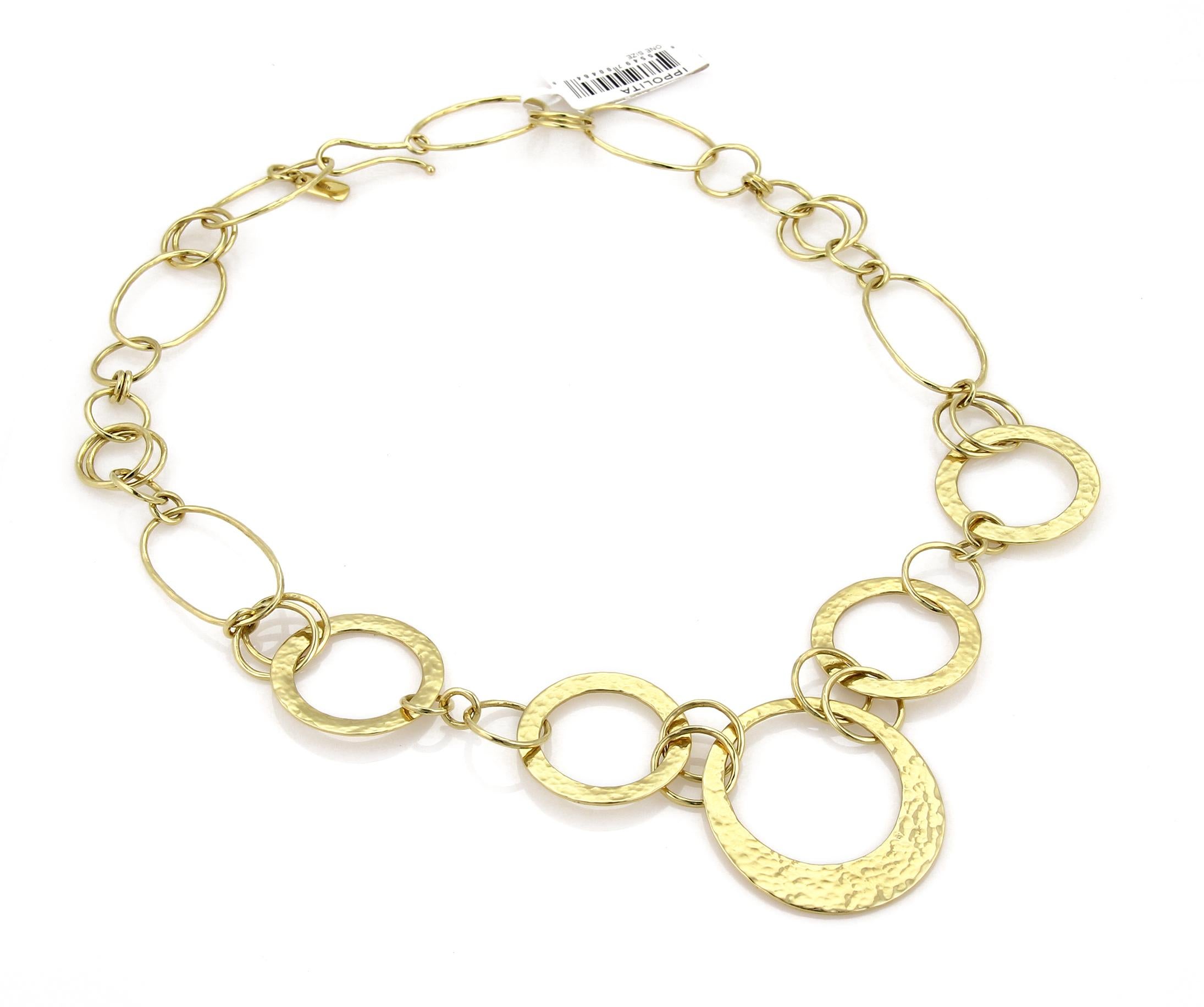 This lovely fashionable authentic necklace is by Ippolita, it is crafted from 18k yellow gold in a polished finish. The necklace has round and oval shape slim and wide flat hammered links. The front center has the hammered design round link and is
