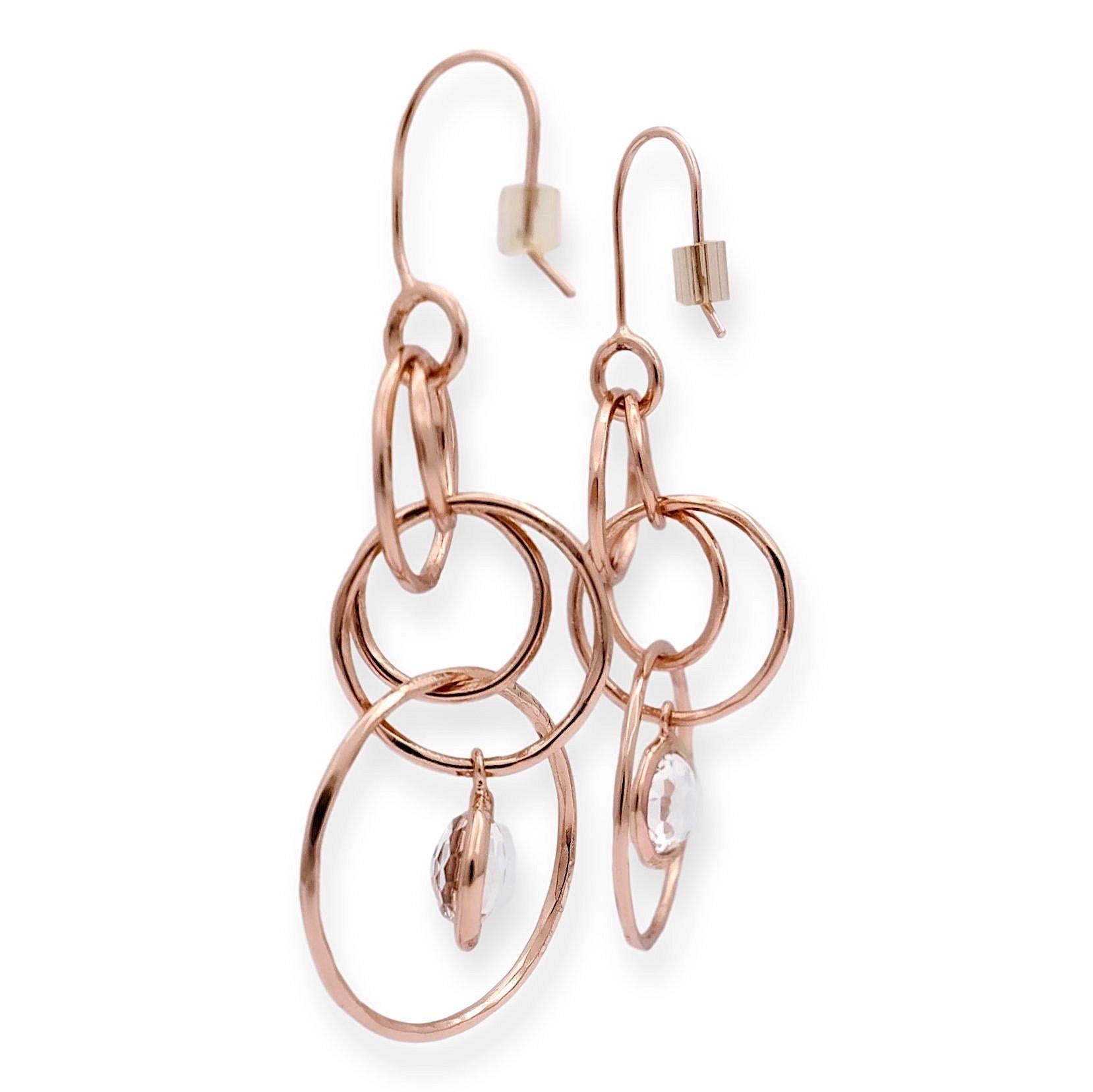 IPPOLITA's exquisite earrings: Rose gold vermeil and sterling silver intertwining hoops, showcasing stunning rock crystal centers in a bezel setting. Effortlessly elegant with a secure wire hook closure. Fully hallmarked with logo and metal