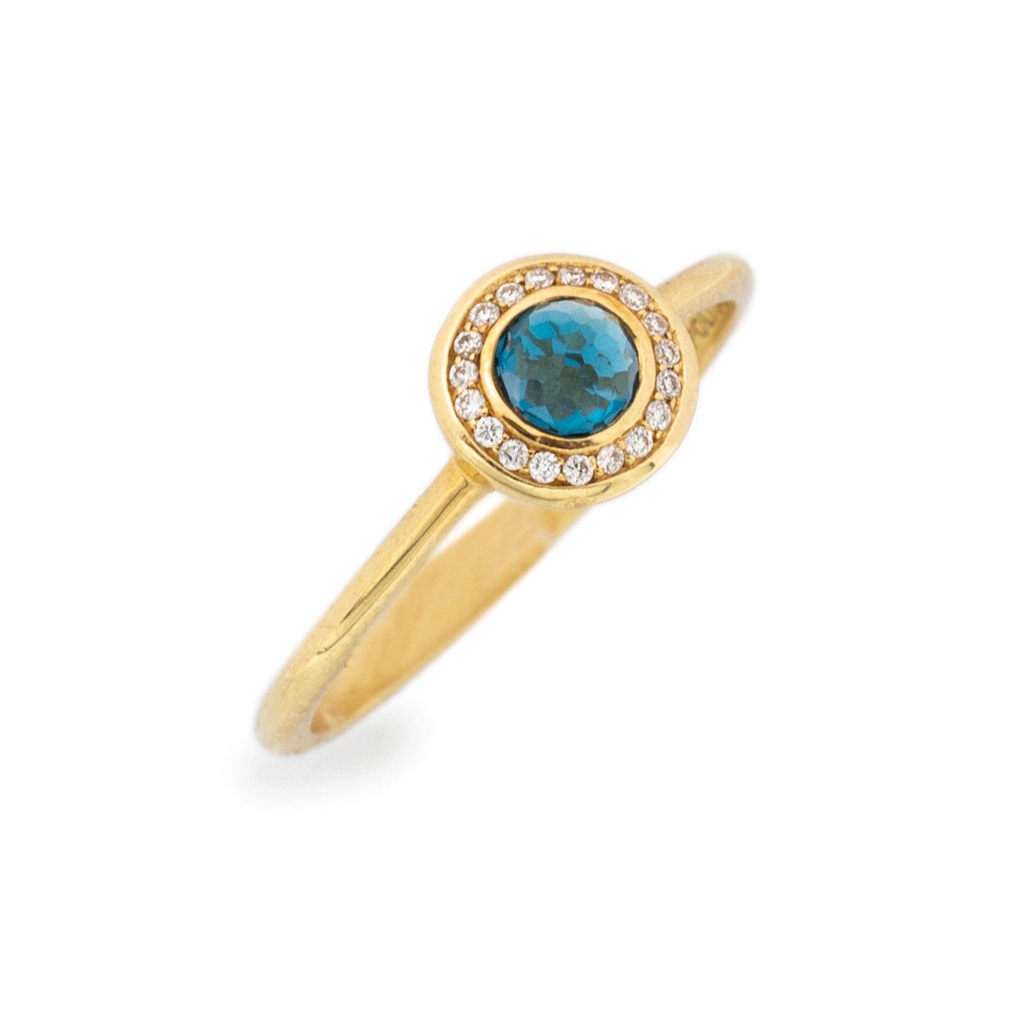 Brand: Ippolita

Gender: Ladies

Metal Type: 18K Yellow Gold

Size: 7

Shank Maximum Width: 1.75mm

Head Measurement: 7.30mm x 7.60mm

Weight: 2.30 grams

Ladies Ippolita 18K yellow gold diamond and blue topaz halo cocktail ring with a half round