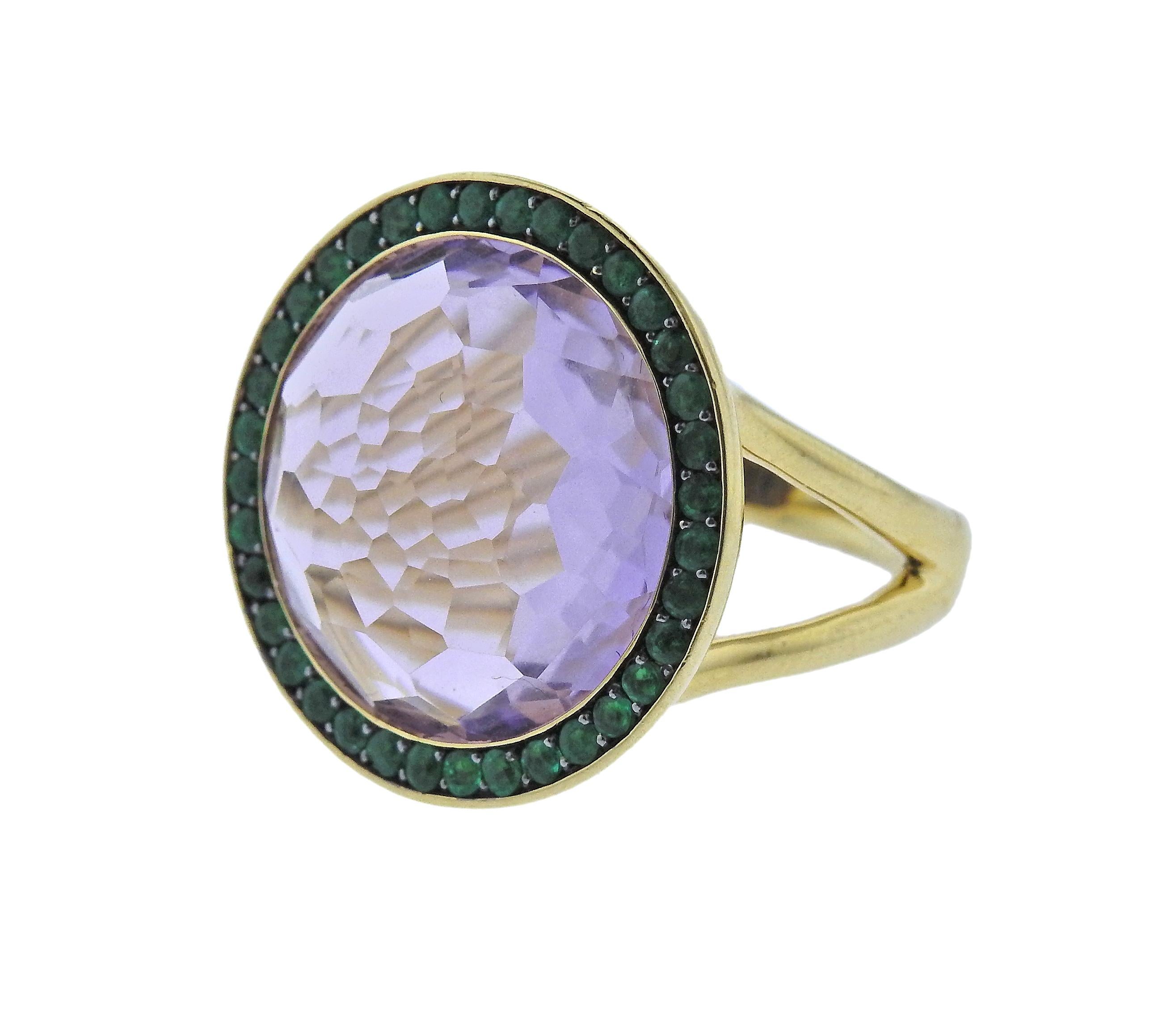 18k gold cocktail ring by Ippolita, set with amethyst, surrounded with emeralds. Ring size - 7 1/4, ring top - 21mm in diameter, weighs 9.6 grams. MArked Ippolita and 18k.  Retail $3195. Comes with Pouch.