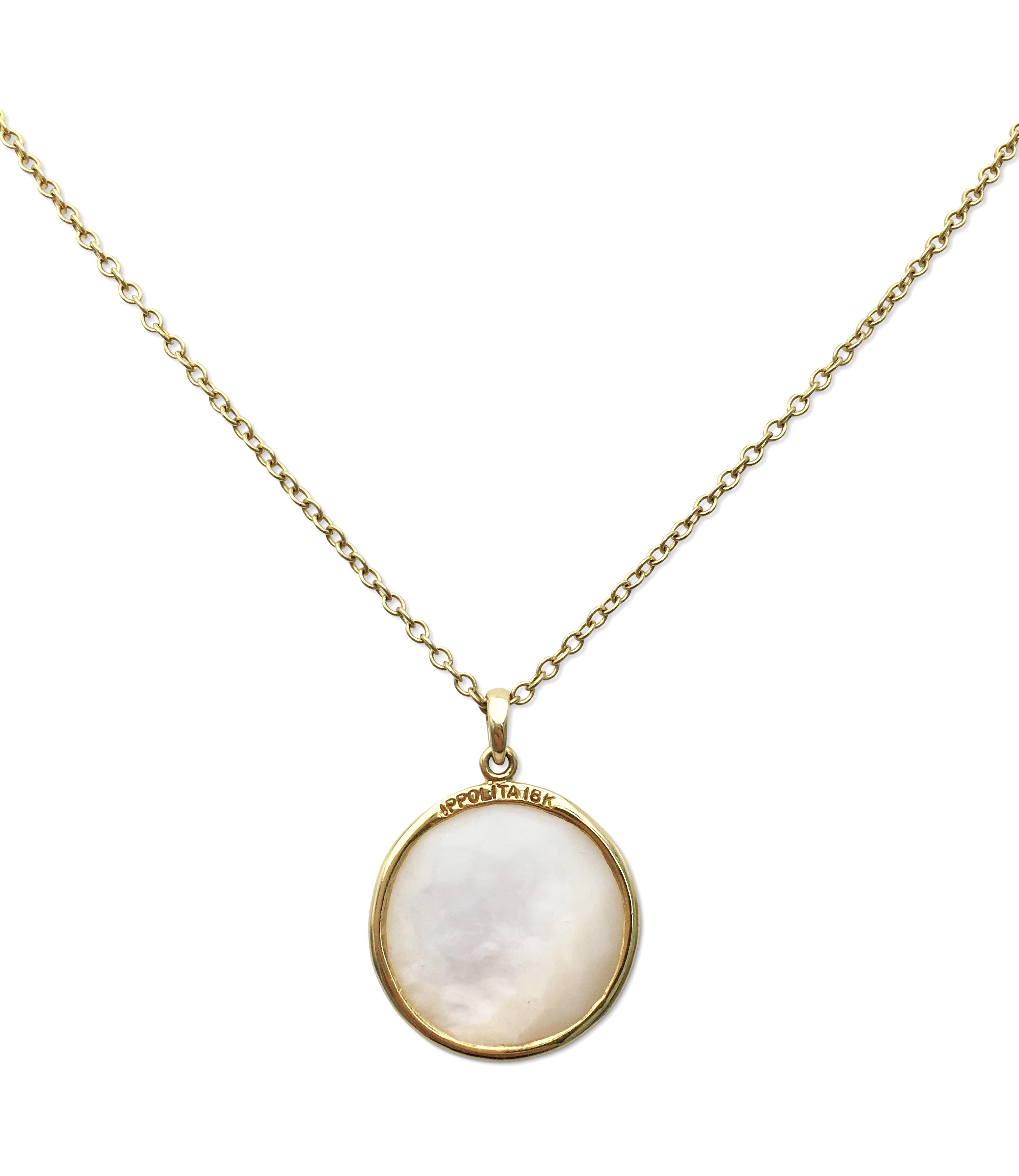 Authentic Ippolita necklace from the 'Lollipop' collection is crafted in 18 karat yellow gold and features a luminous mother-of-pearl doublet pendant. The delicate chain measures 15 1/2 inches in length. Signed Ippolita, 18K. The necklace is not