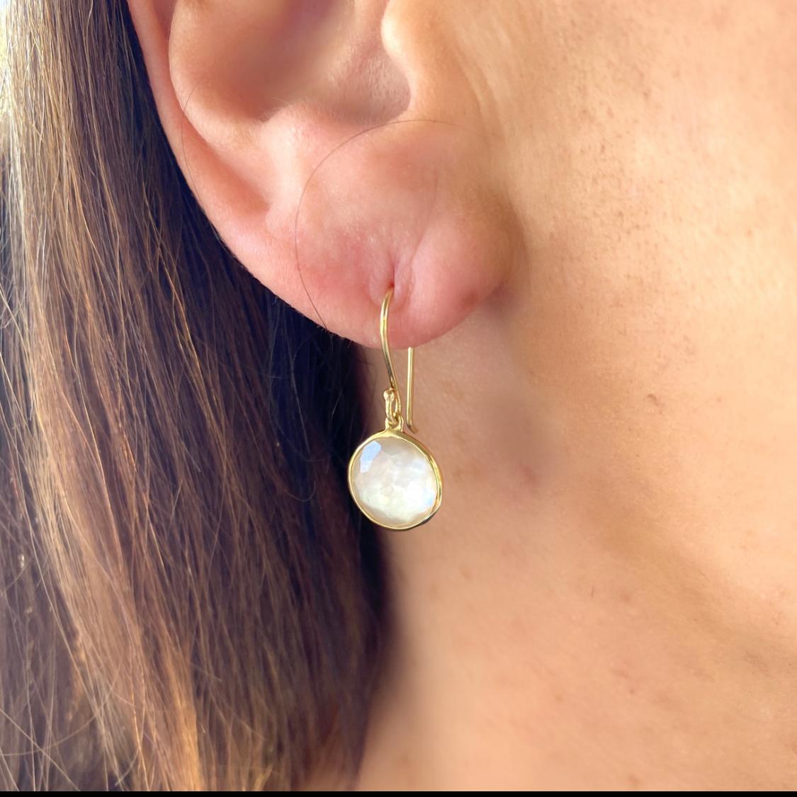 From the Lollipop collection, these 18k drop earrings feature round faceted rock crystal backed by mother-of-pearl. The earrings weigh 2.7 grams, and are 1-in. long. A great pair of earrings that will become your new staple go-to!