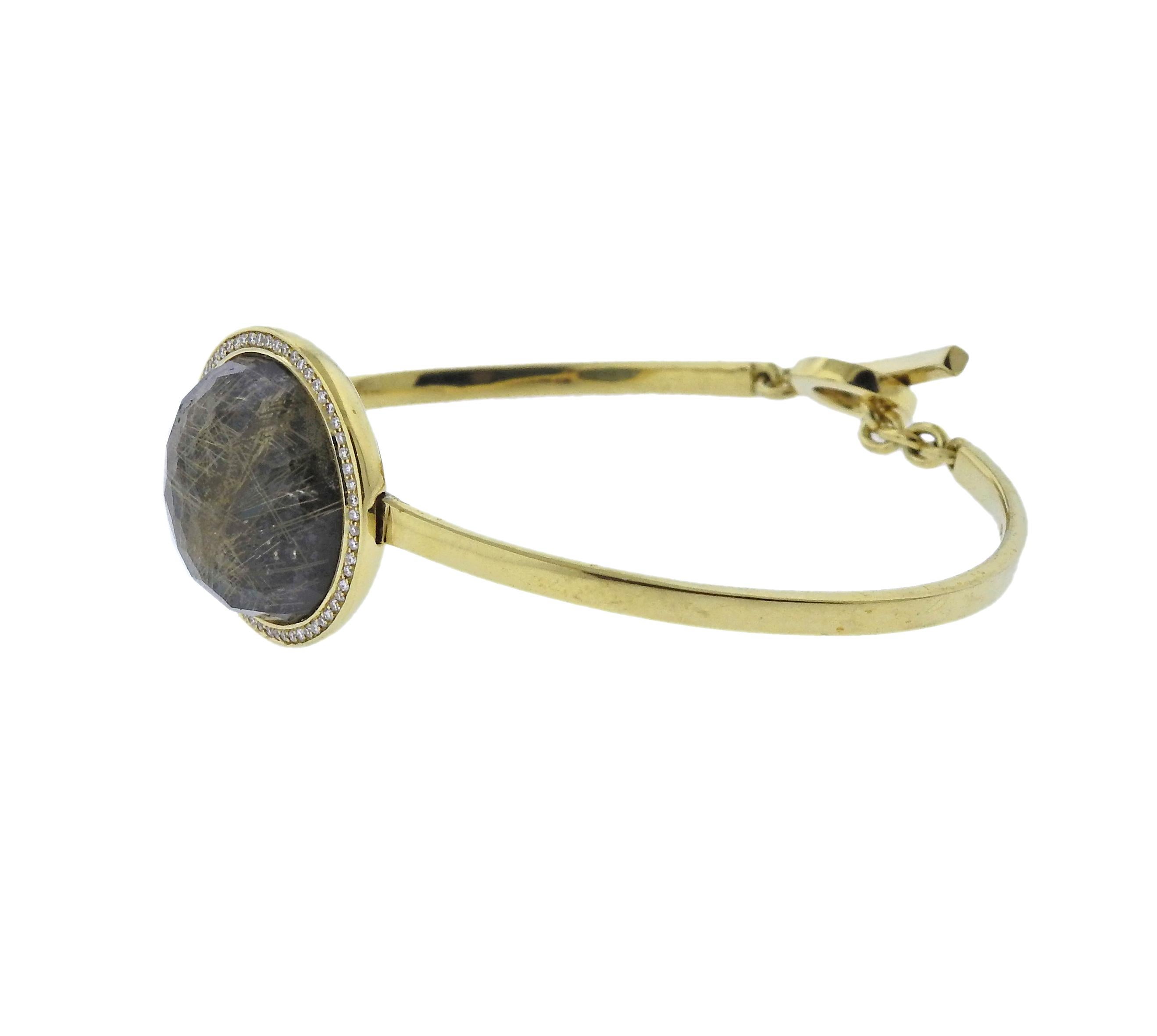 18k gold toggle bracelet by Ippolita, featuring rutilated quartz, hematite, surrounded approx. 0.25ctw in diamonds. Bracelet will fit up to 7