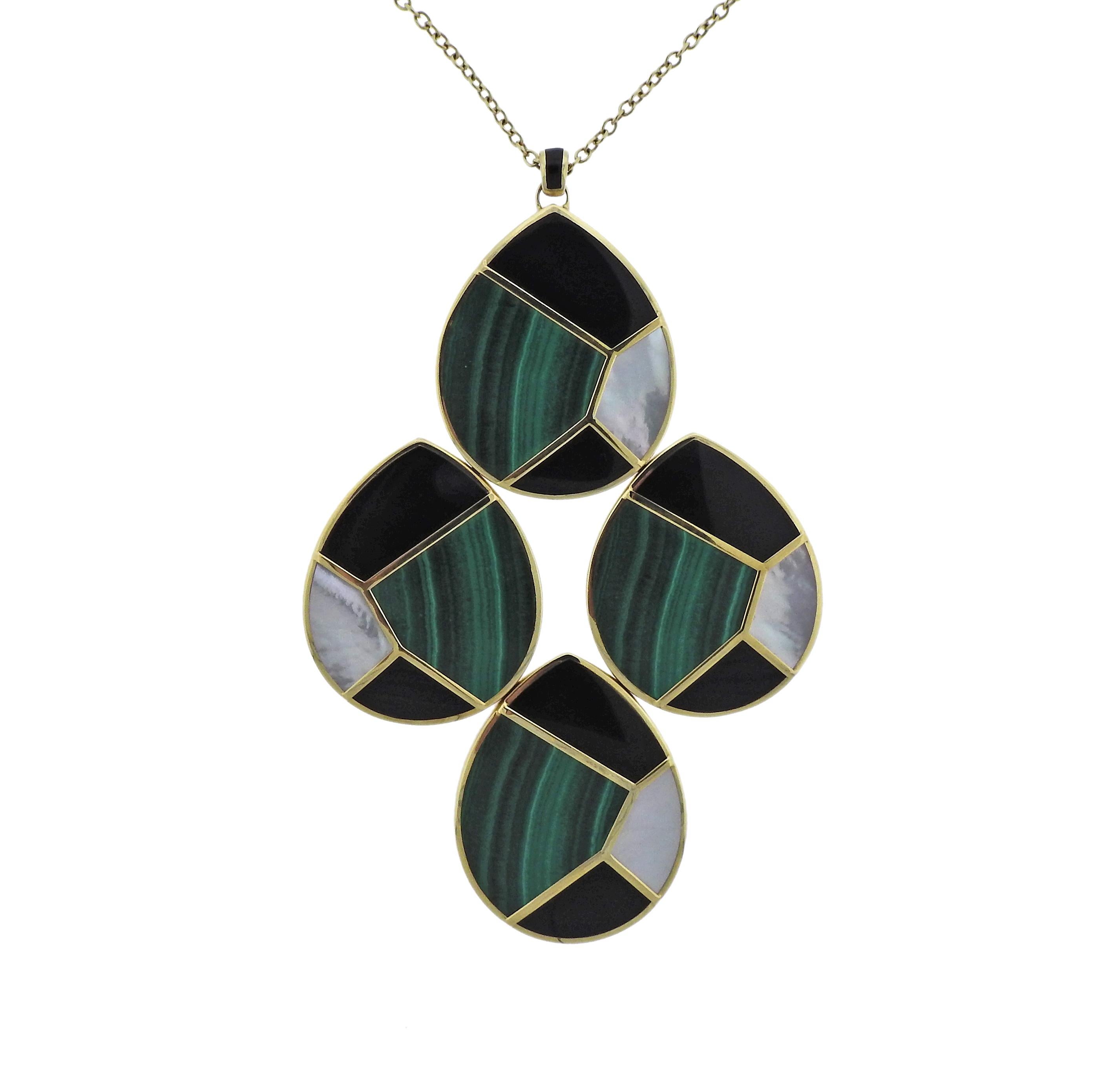 18k gold necklace by ippolita, featuring large pendant, set with malachite, mother of pearl and onyx.  Necklace is 26