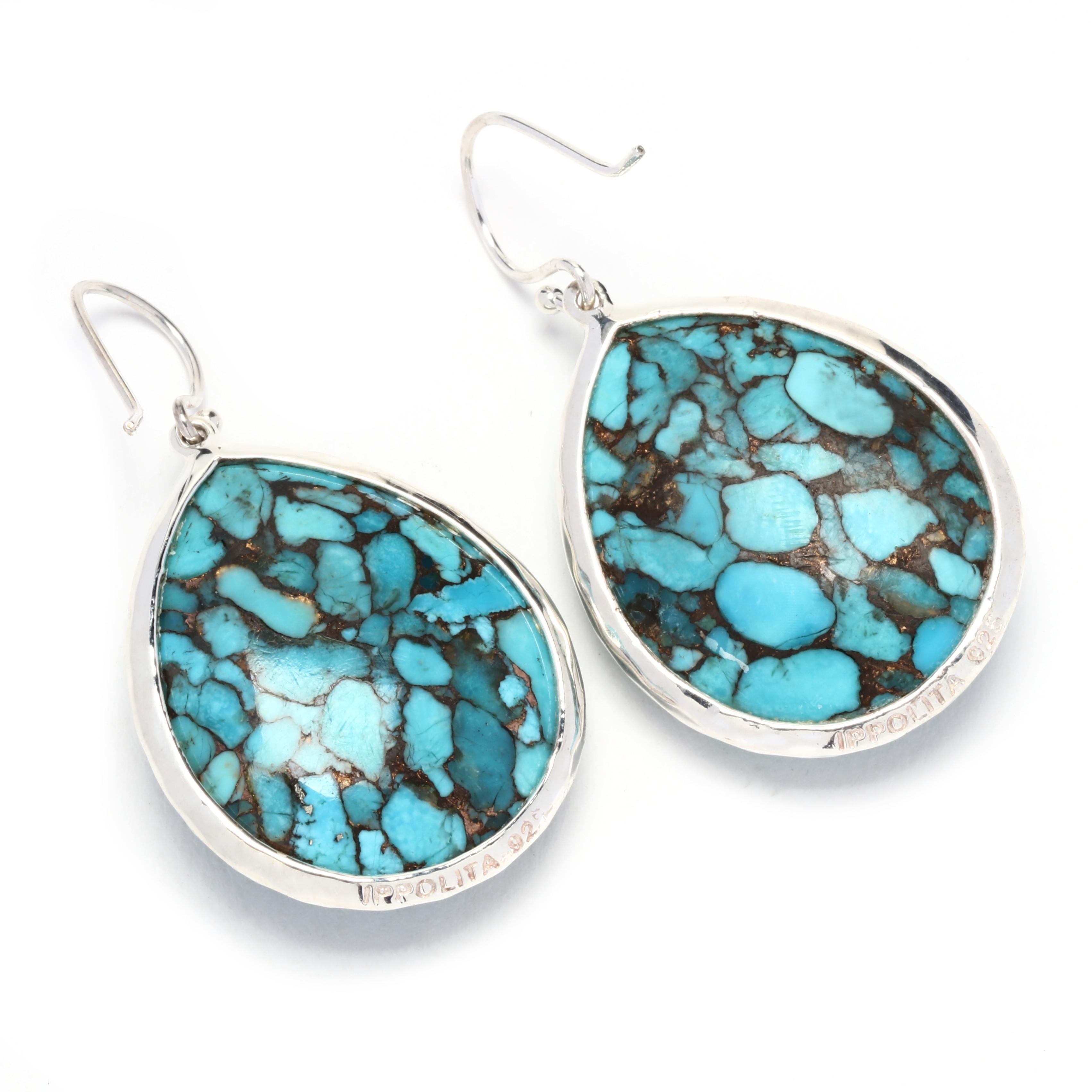 This Ippolita Rock Candy Bronze Turquoise Teardrop Earrings are a beautiful and unique addition to your jewelry collection. Made from sterling silver, these earrings feature teardrop-shaped turquoise gemstones that are set in a bronze bezel. With a