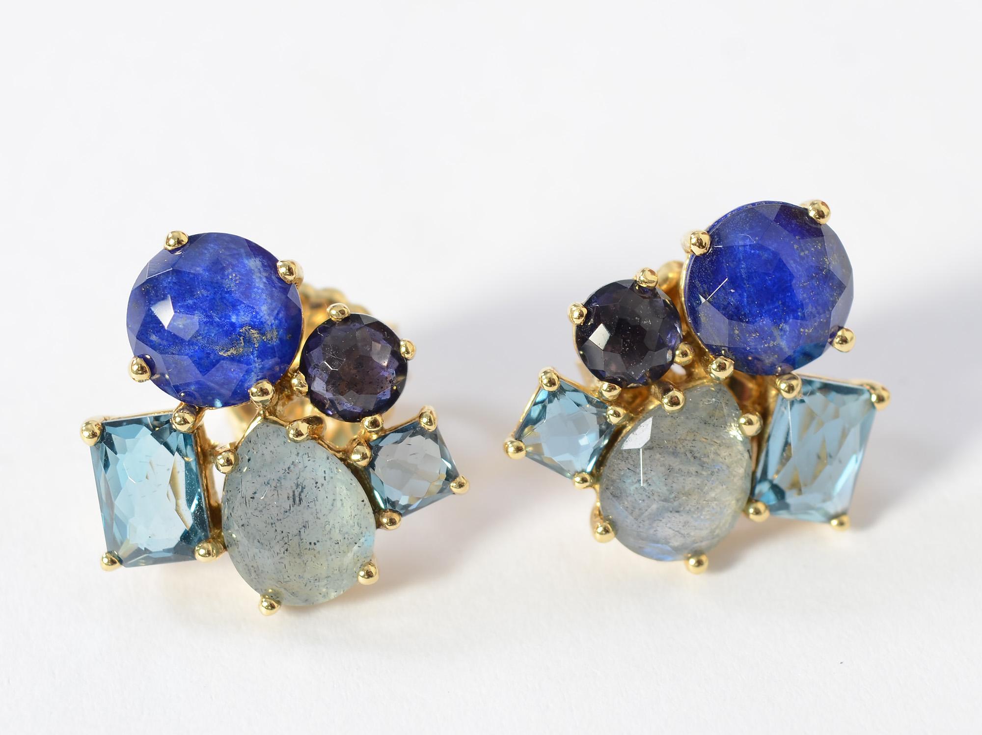 Ippolita cluster earrings with five different sizes and shapes of stones, all in beautiful shades of blue. The largest stone is feldspar; the others include blue topaz; aquamarine and  tanzanite.  The earrings  are part of Ippolita's Rock Candy
