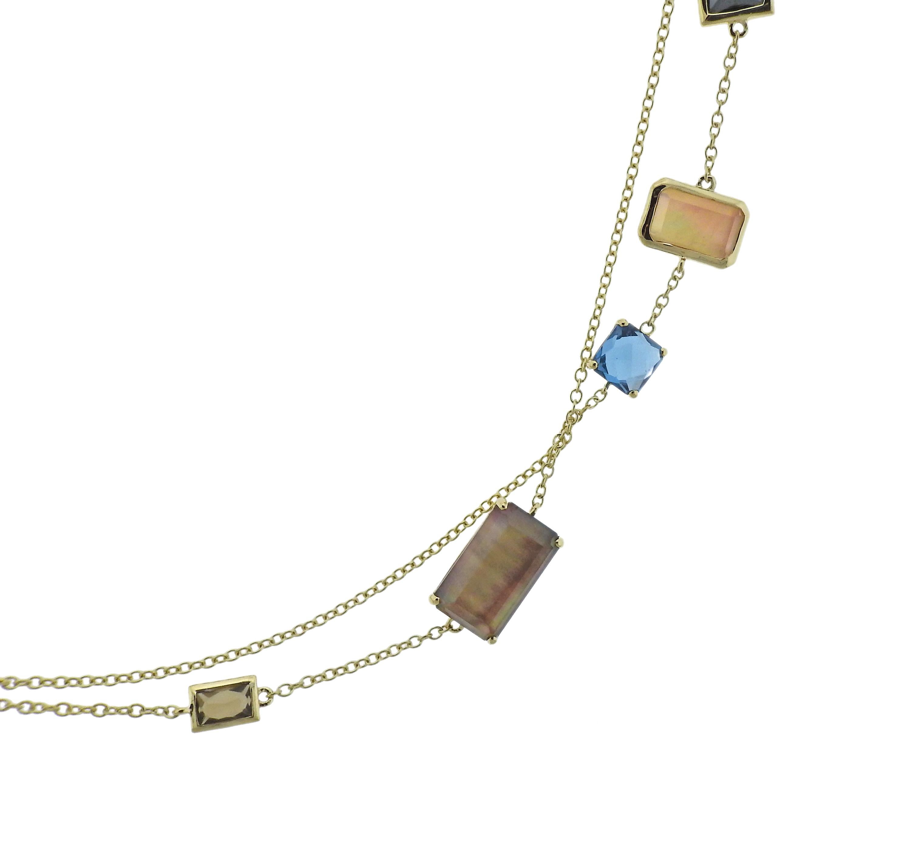 18k gold long station necklace by Ippolita, set with Hematite, Quartz, Topaz, Citrine, Shell. Necklace is 36