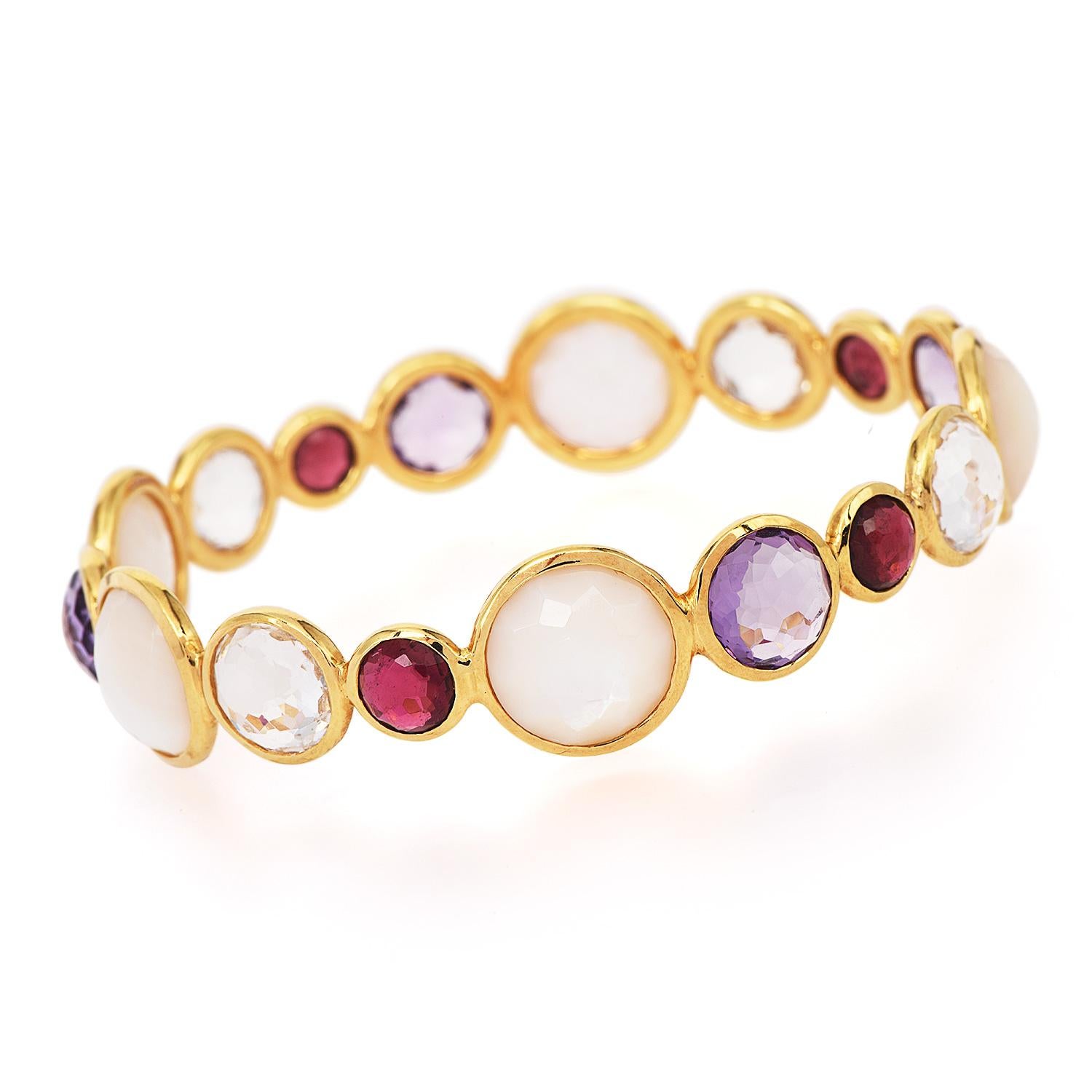 Playful and colorful Ippoita Bangle bracelet, from the Rock Candy Collection.

Expertly crafted in solid 18K Yellow Gold.

A beaded design with multicolor gemstones, presenting Rock Crystal, Mother-of-Pearl, Amethyst,  Aquamarine, and