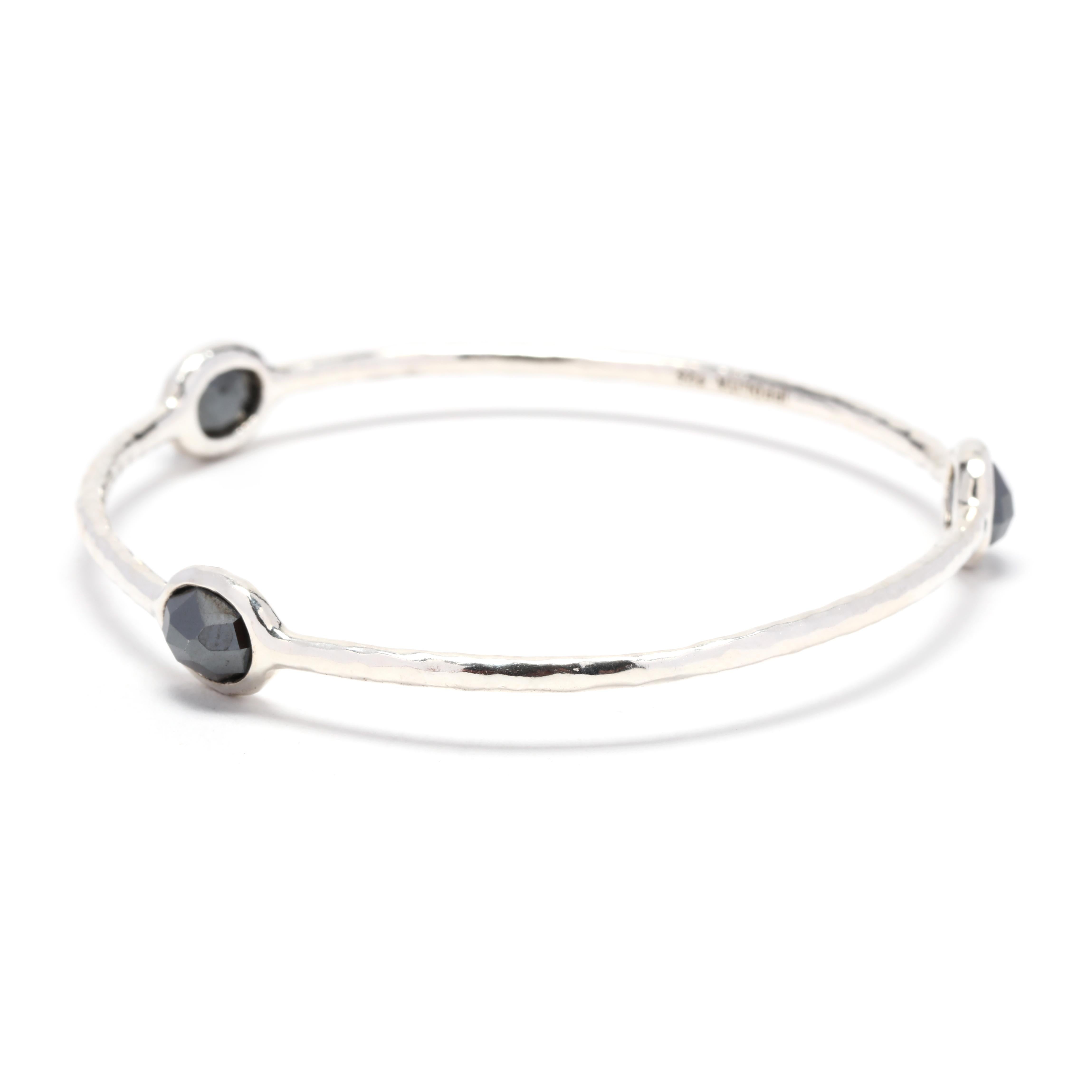 This Ippolita Rock Candy Hematite 3 Stone Bangle is a beautiful and unique piece of jewelry. Made from high-quality sterling silver, this bangle bracelet features three stunning hematite gemstones that add a touch of elegance to any