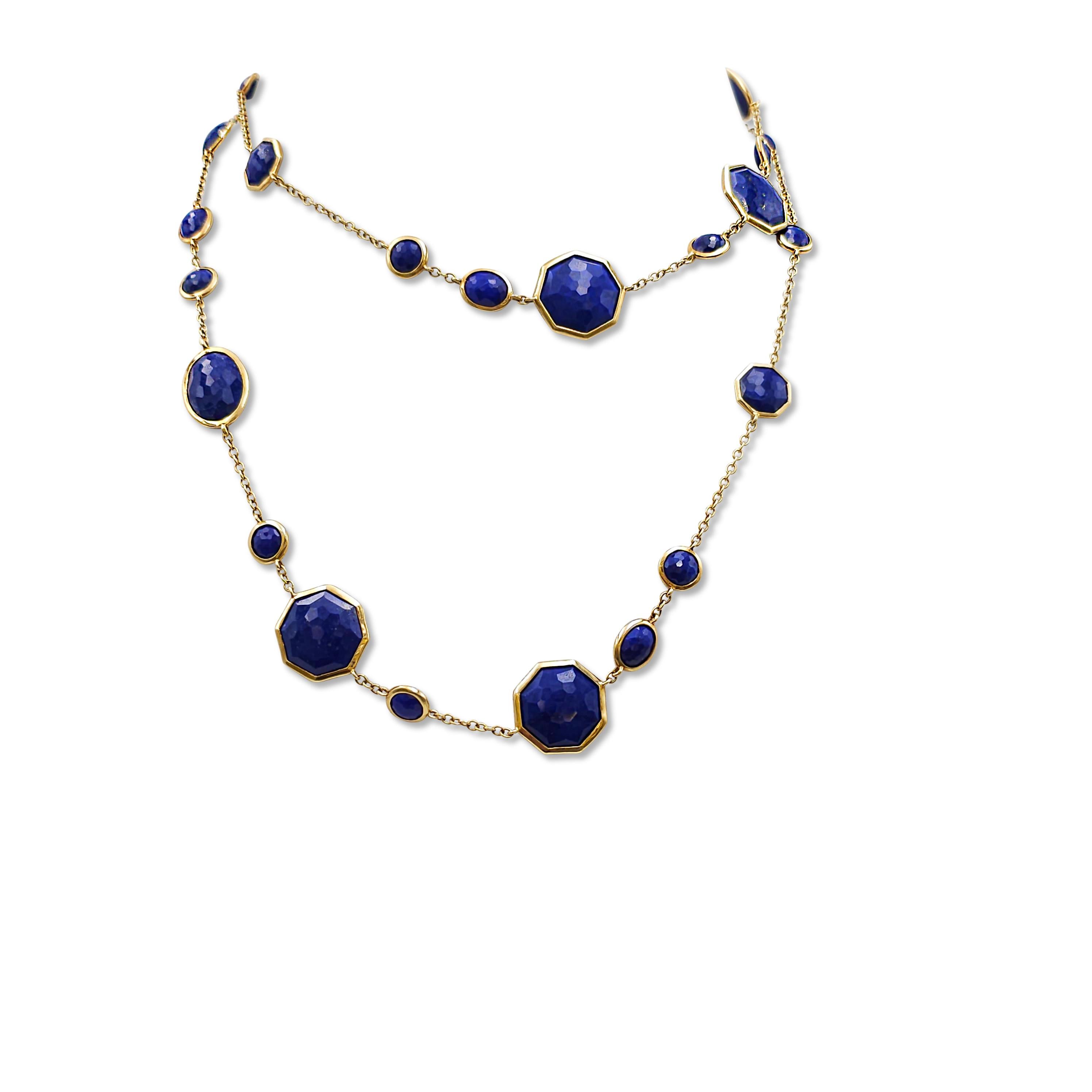 Authentic Ippolita Lollipop necklace from the Rock Candy collection crafted in 18 karat yellow gold.  Featuring a playful mix of stations of faceted round and octagonal shaped lapis of varying sizes bezel set in high polished gold.  The necklace