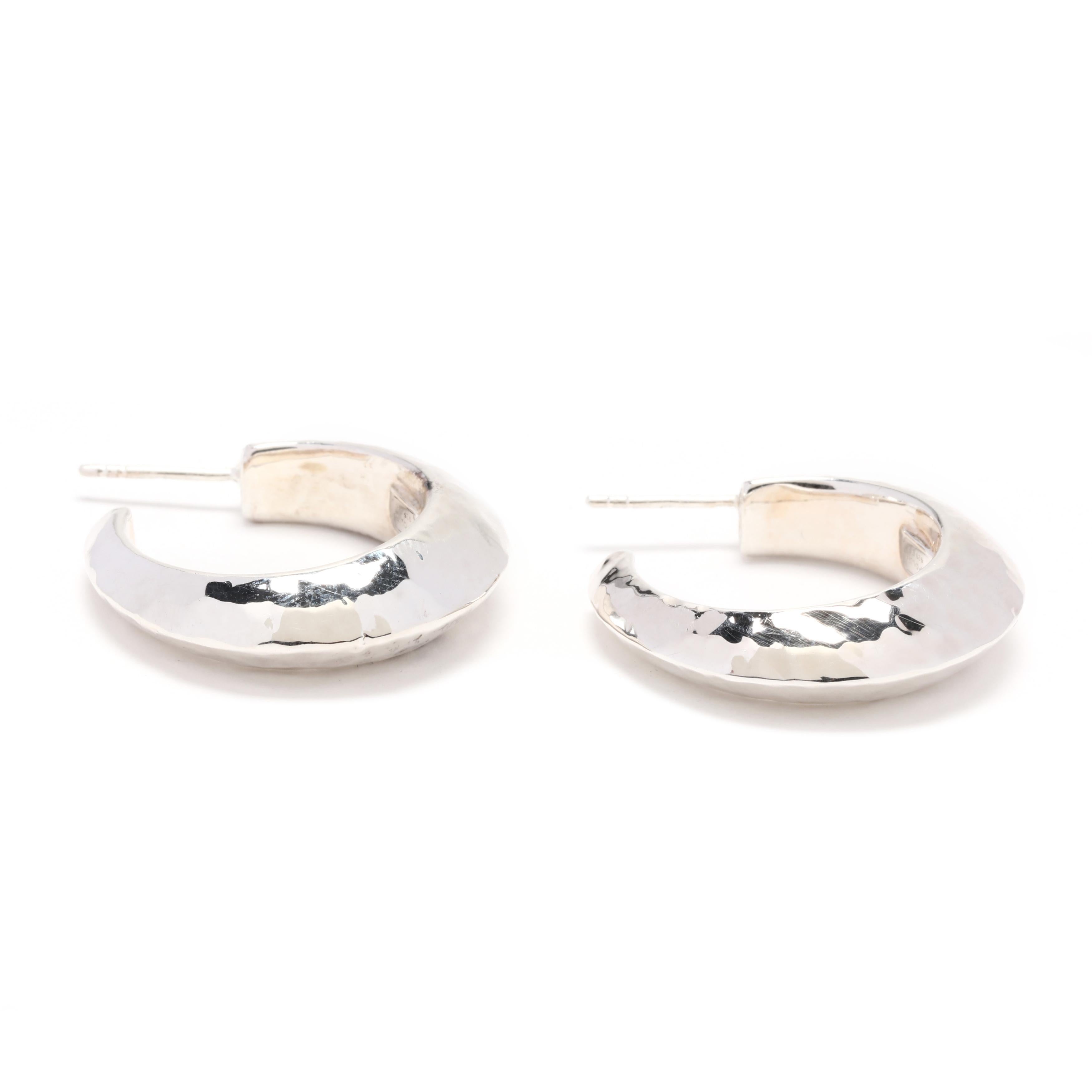 A pair of Ippolita sterling silver hammered hoop earrings. These medium size earrings feature a tapered, hammered knife edge hoop earrings with pierced butterfly backs.



Length: 1 1/16 in.



Width: 8 mm



Weight: 6.3 grams