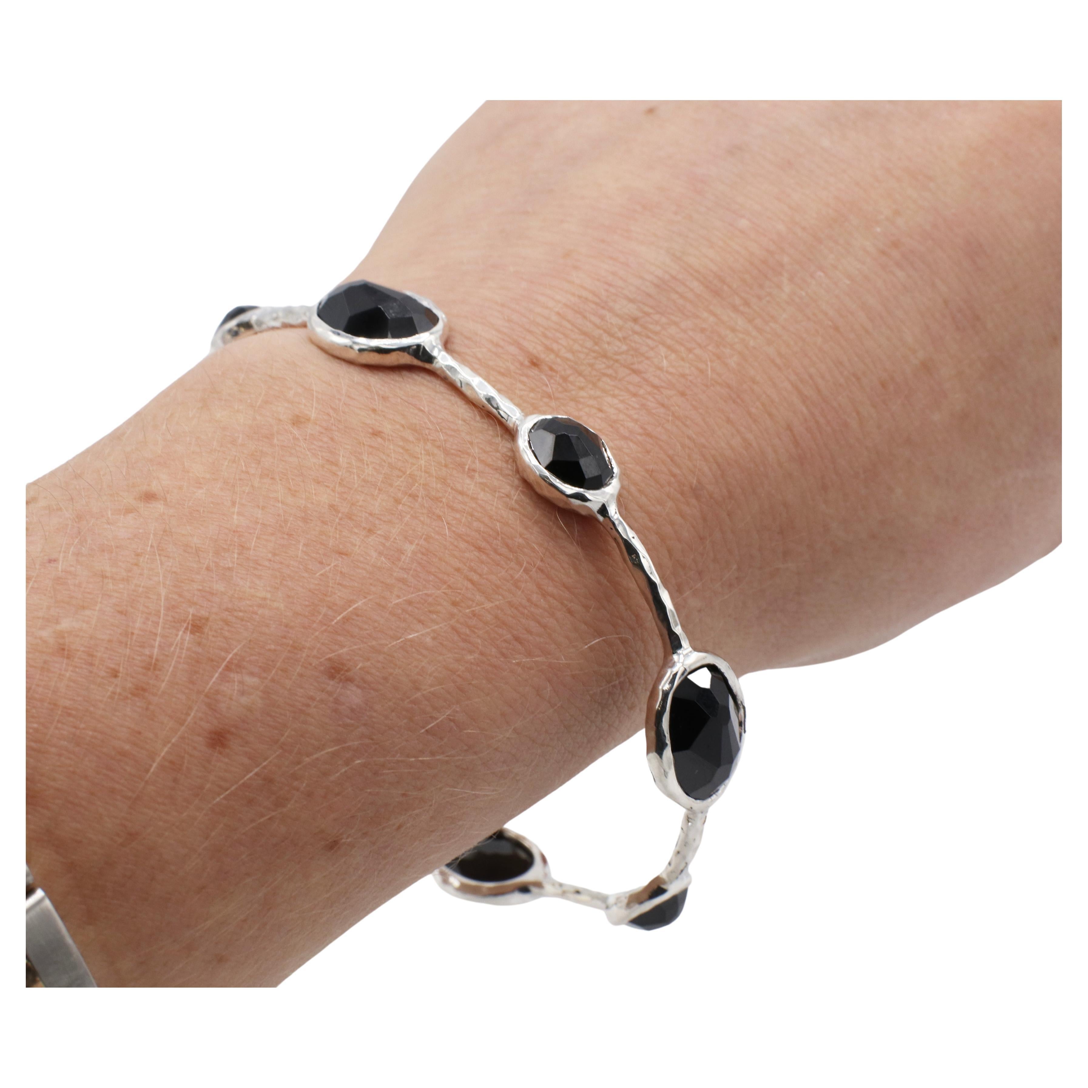 Ippolita Sterling Silver Rock Candy Black Onyx Faceted Bangle Bracelet 
Metal: Sterling silver 925
Weight: 15.6 grams
Circumference: 6.5 inches
Width: 2 - 11mm
Signed: Ippolita 925

