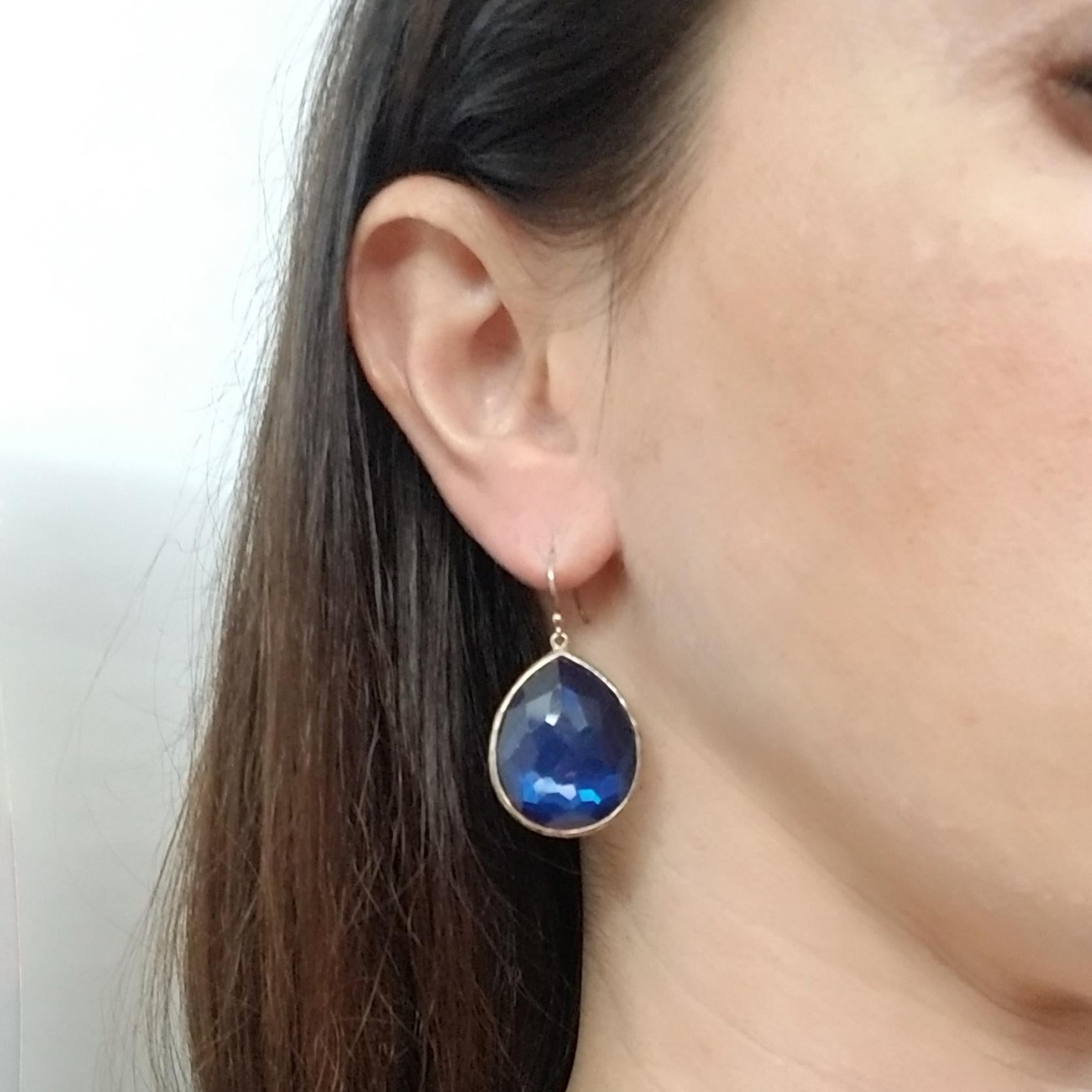 Large sterling silver drop earrings crafted by Italian designer Ippolita. They feature pear-cut hematite backs and faceted quartz fronts with a dark blue tone. The attachment is a shepherd's hook. $550 MSRP. Stone portion of earrings measure