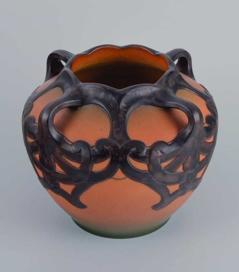 Ipsens, Denmark, beautiful Art Nouveau vase with glaze in orange and green tones.
Model number 675.
1920s/30s.
Marked.
In excellent condition.
Dimensions: D 20.0 x H 23.0 cm.