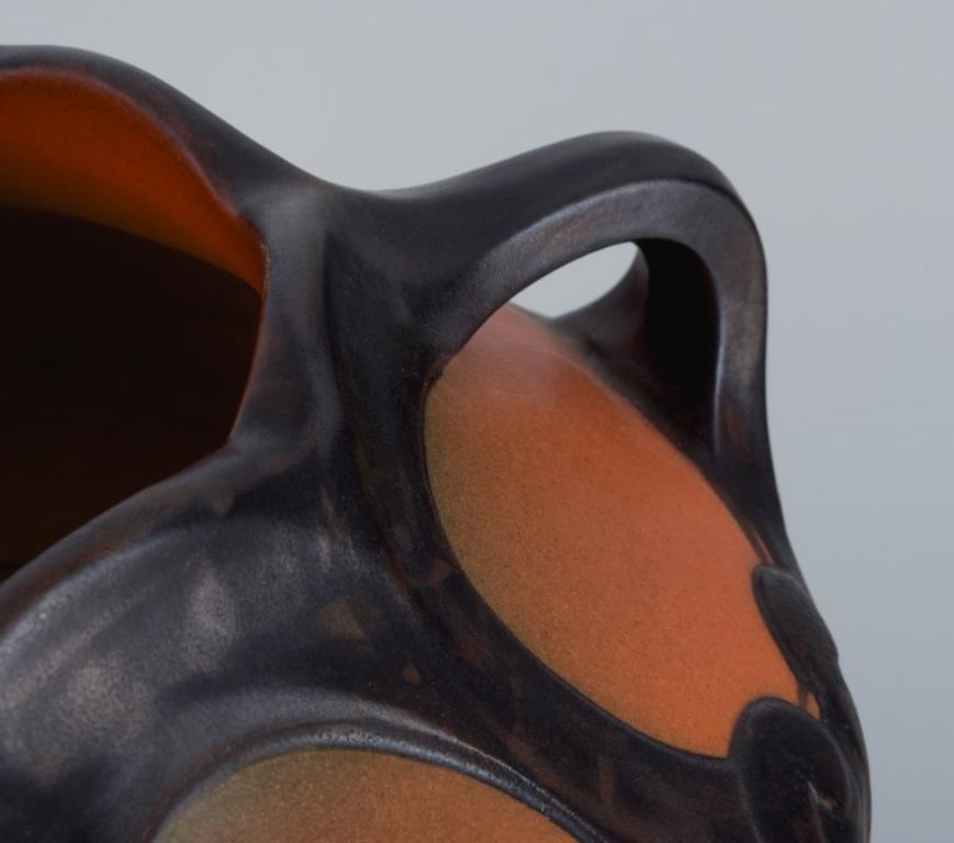 Early 20th Century Ipsens, Denmark, Art Nouveau Vase with Glaze in Orange and Green Tones